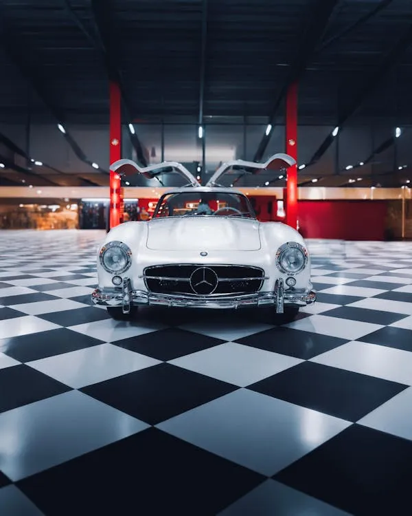 Iconic Mercedes in Showroom with Black and White Floor