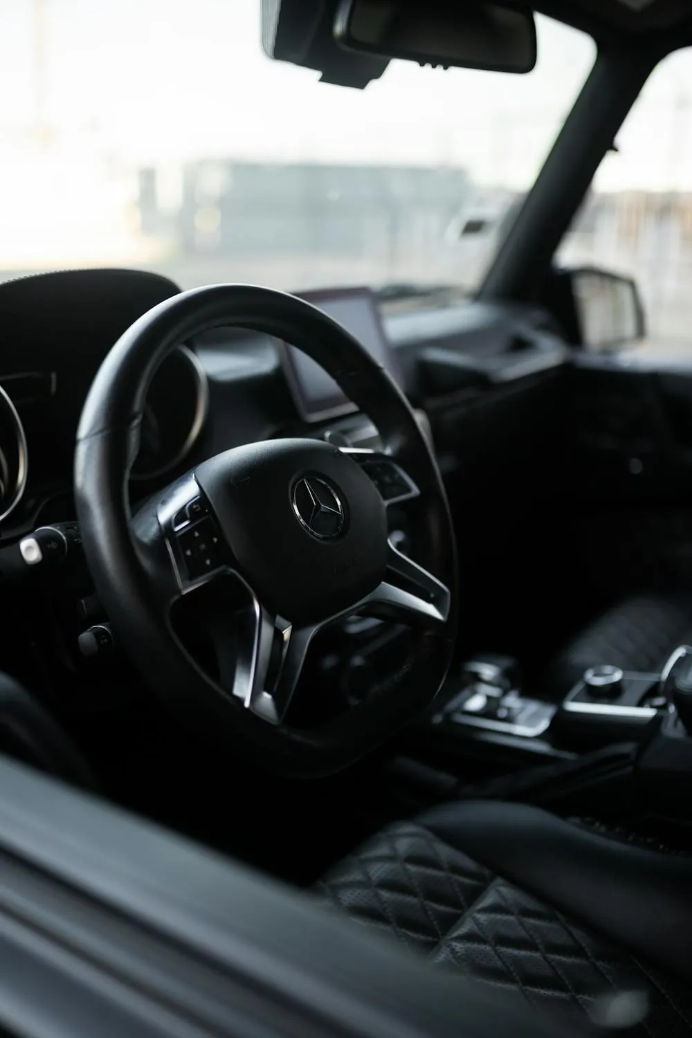 Interior View of Black Mercedes Benz Steering Wheel