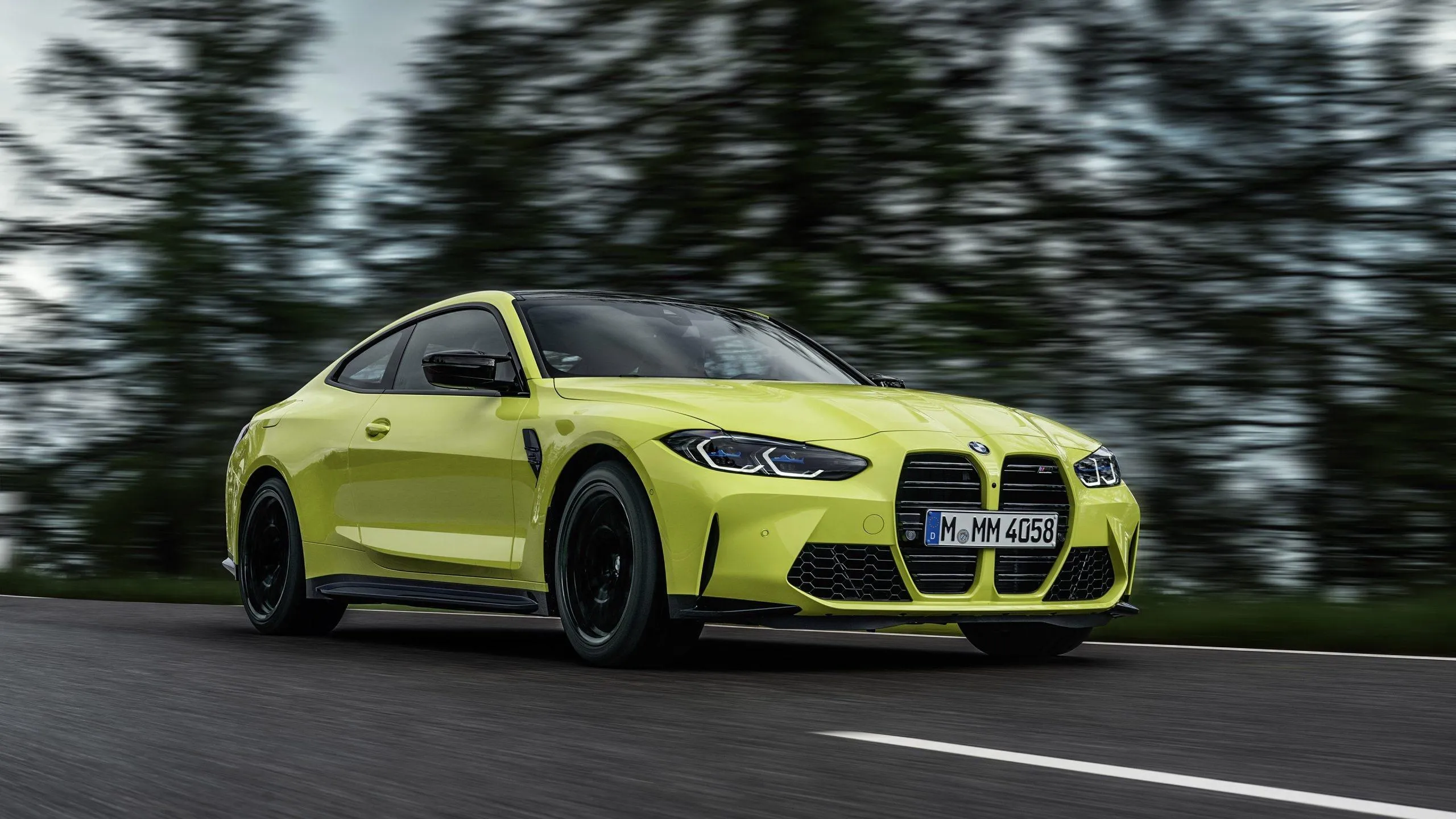 Lime Green Bmw Coupe Driving on Forest Road Hd Image
