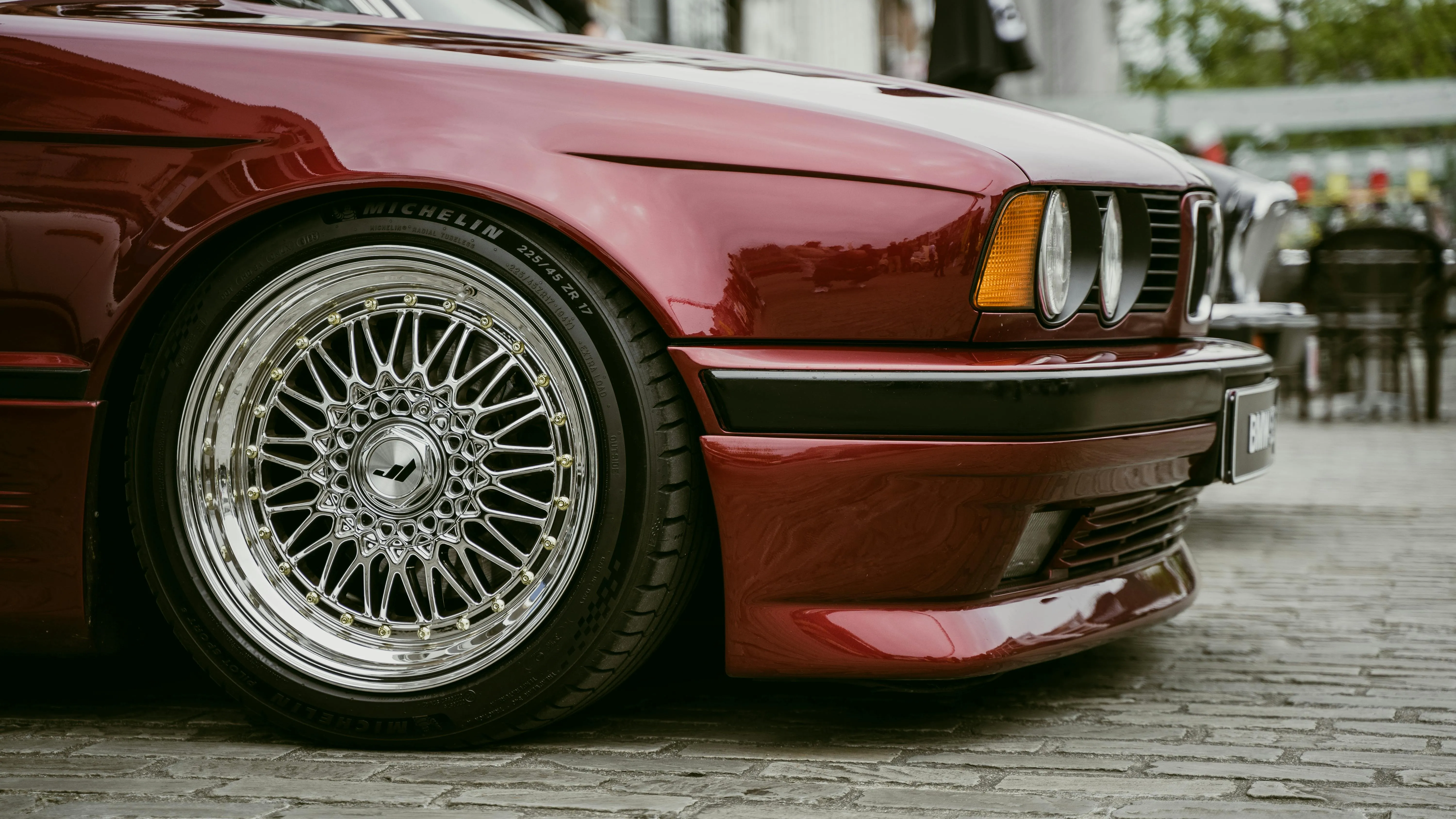 Low Angle View of Red Bmw with Deep Dish Alloy Wheels