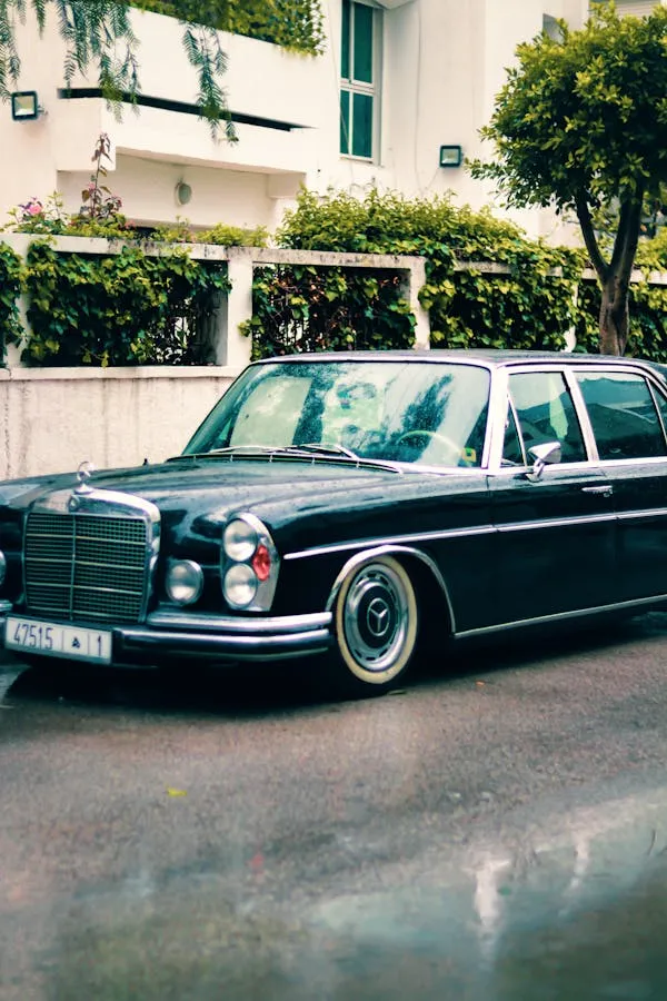 Low Classic Mercedes Benz Parked in Front of Building