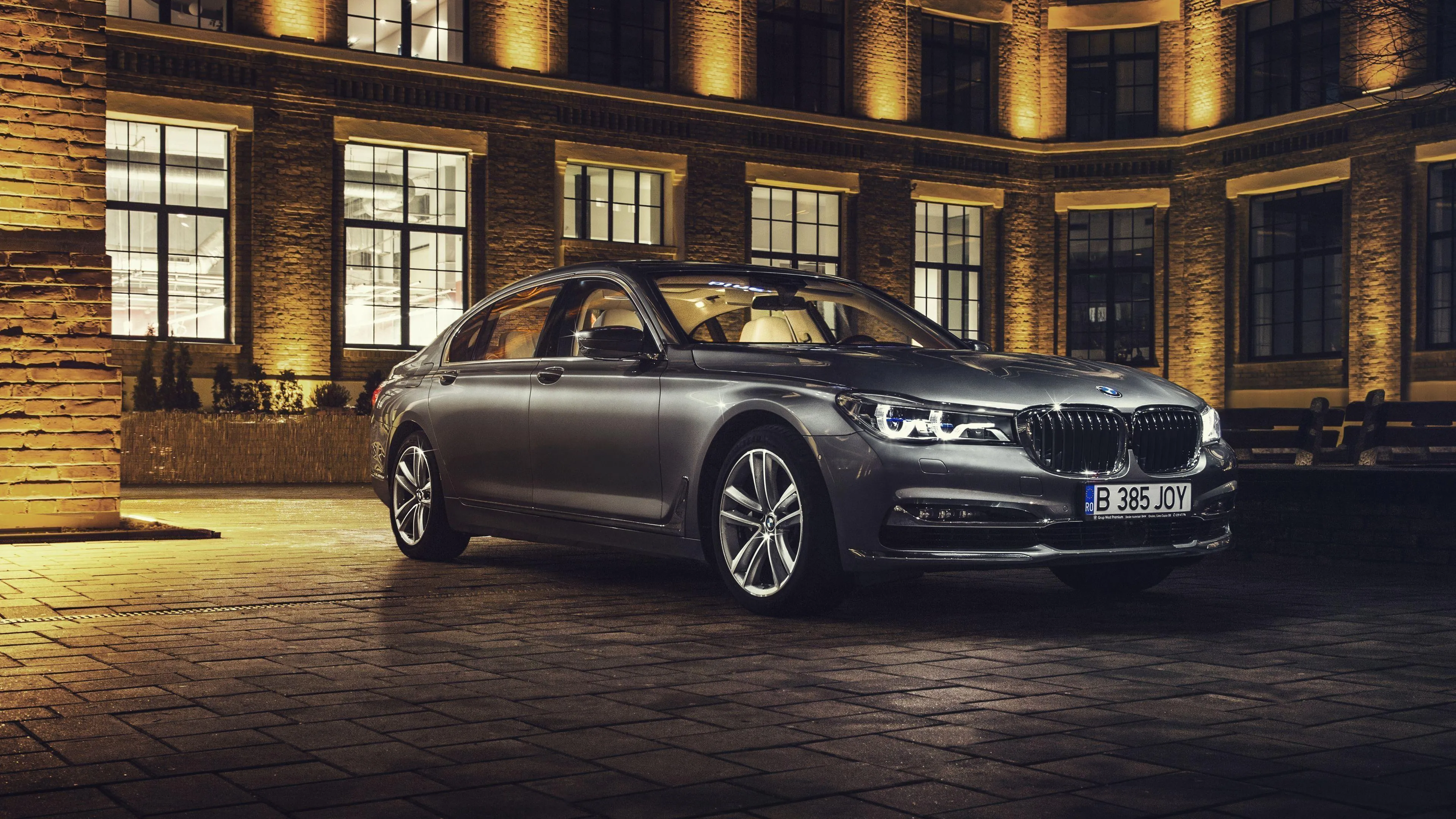 Luxurious Black Bmw Parked Outside a Grand City Hotel