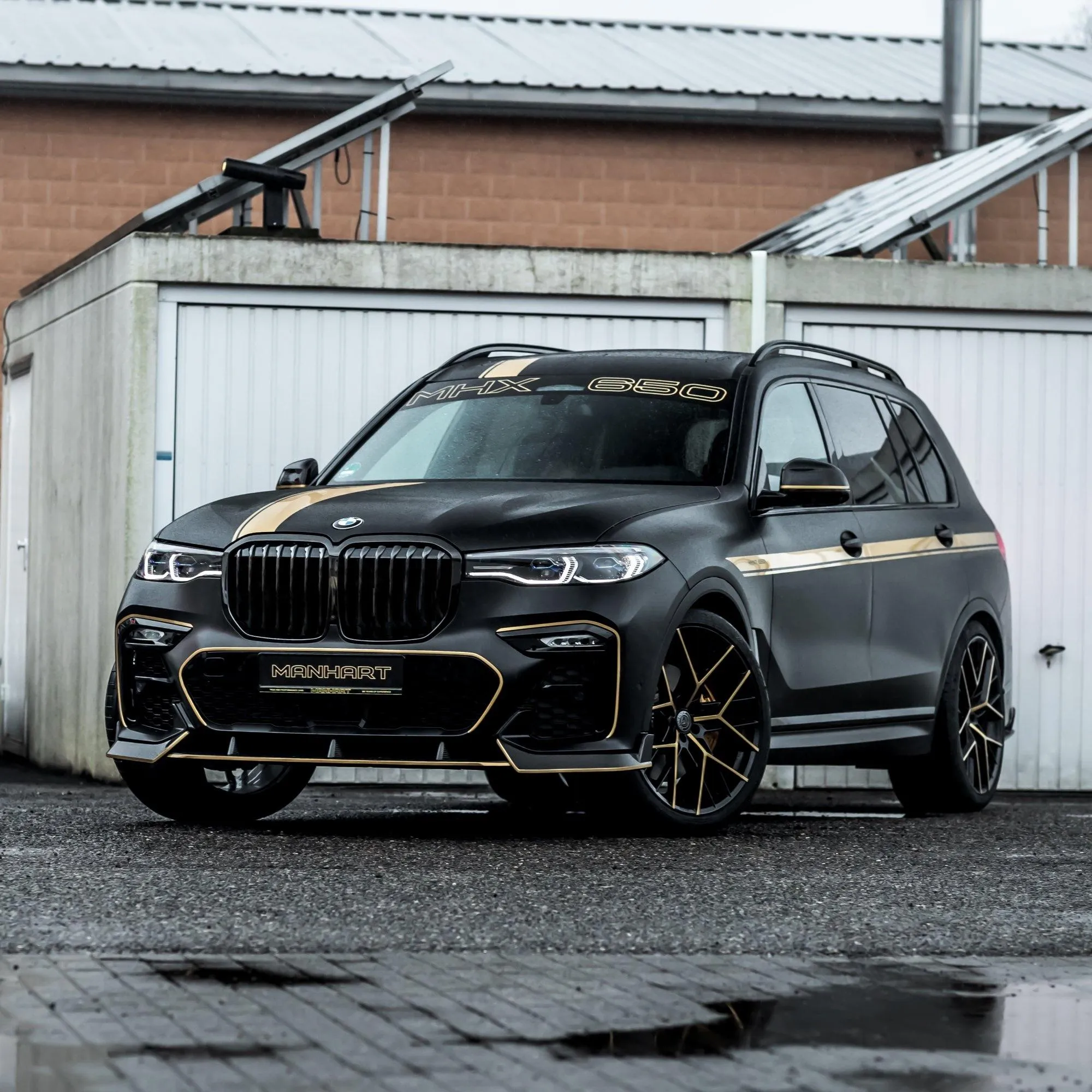 Luxury Black Bmw Suv Parked Beside Industrial Building
