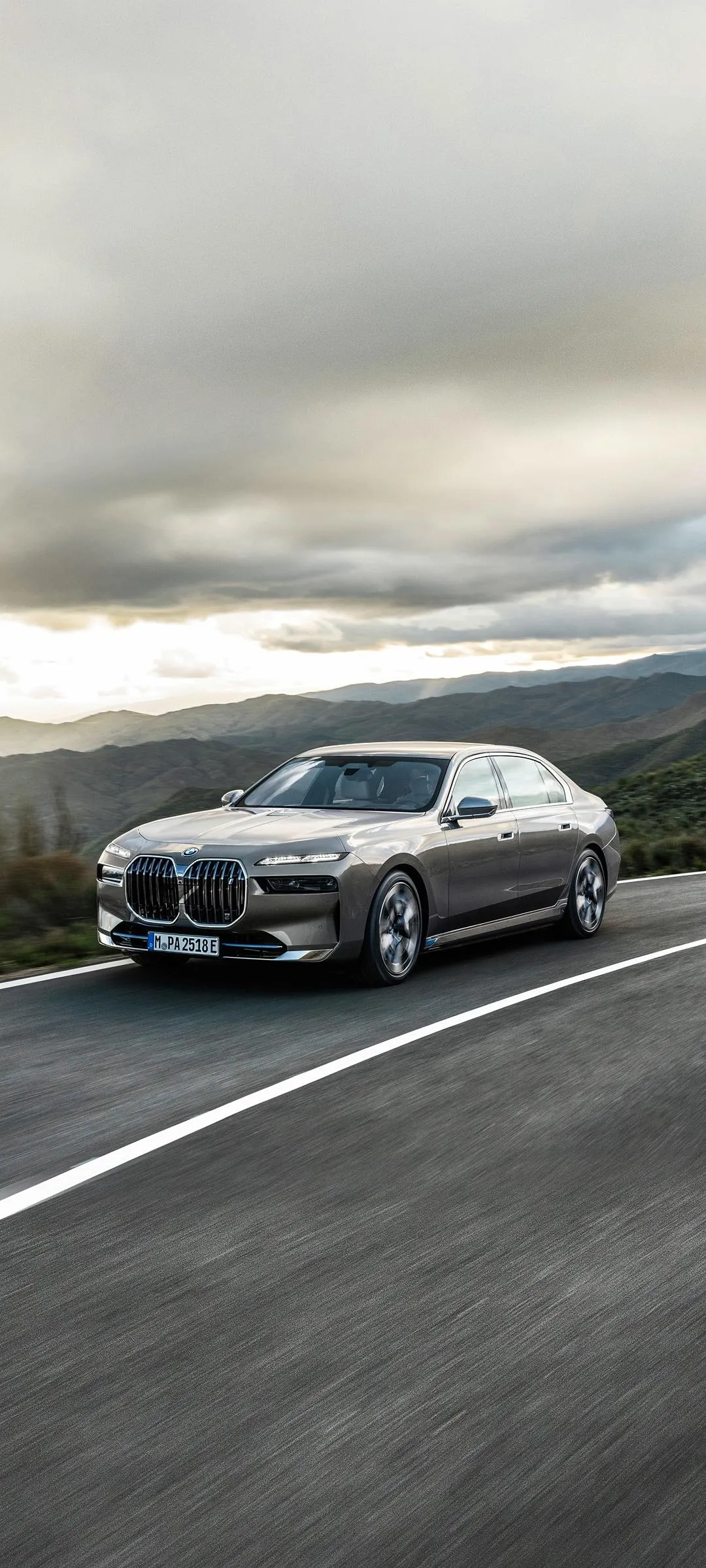 Luxury Bmw Sedan Driving Under Cloudy Sky on Highway