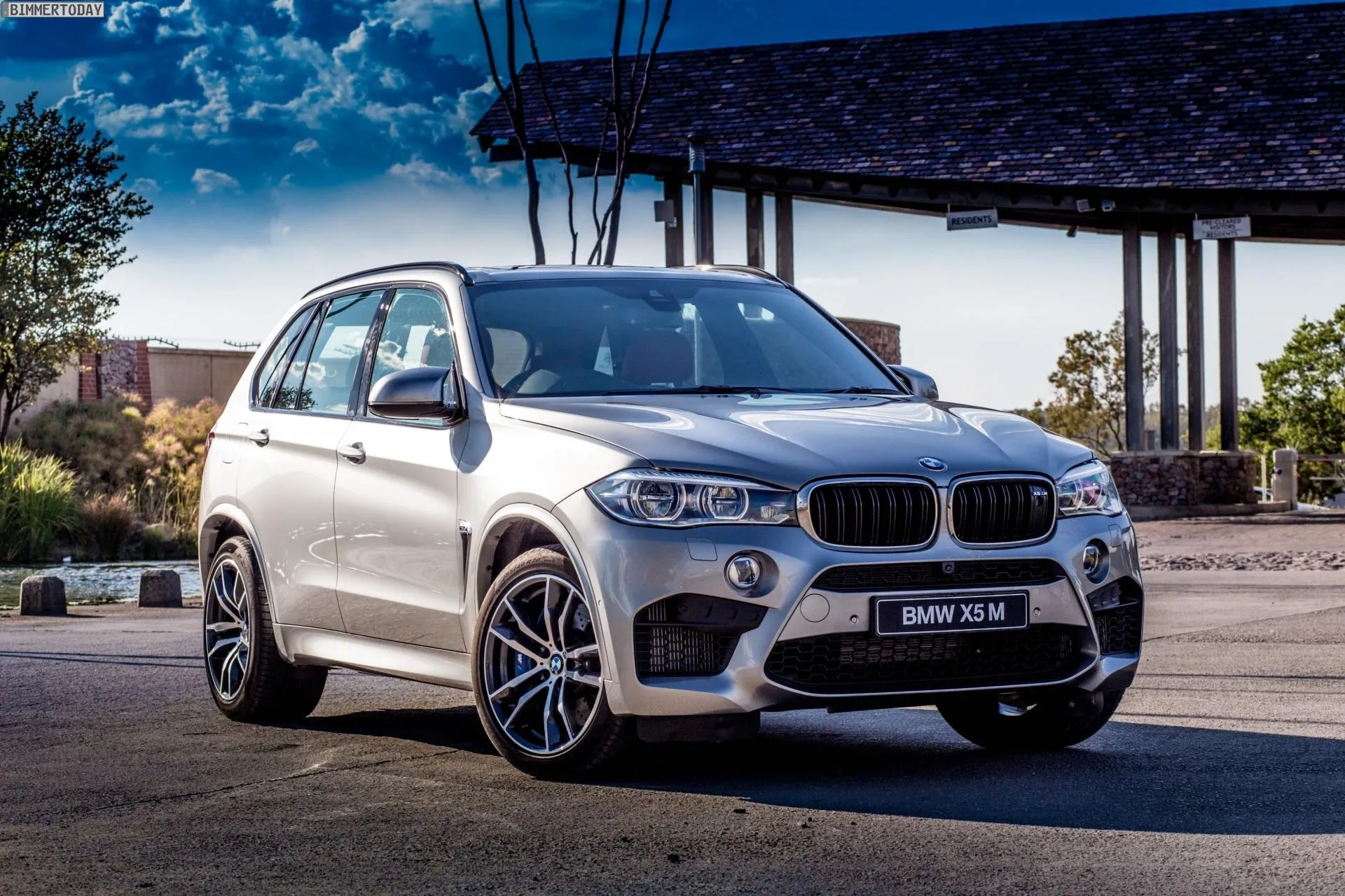 Luxury Bmw Suv Parked in Driveway Near Modern House