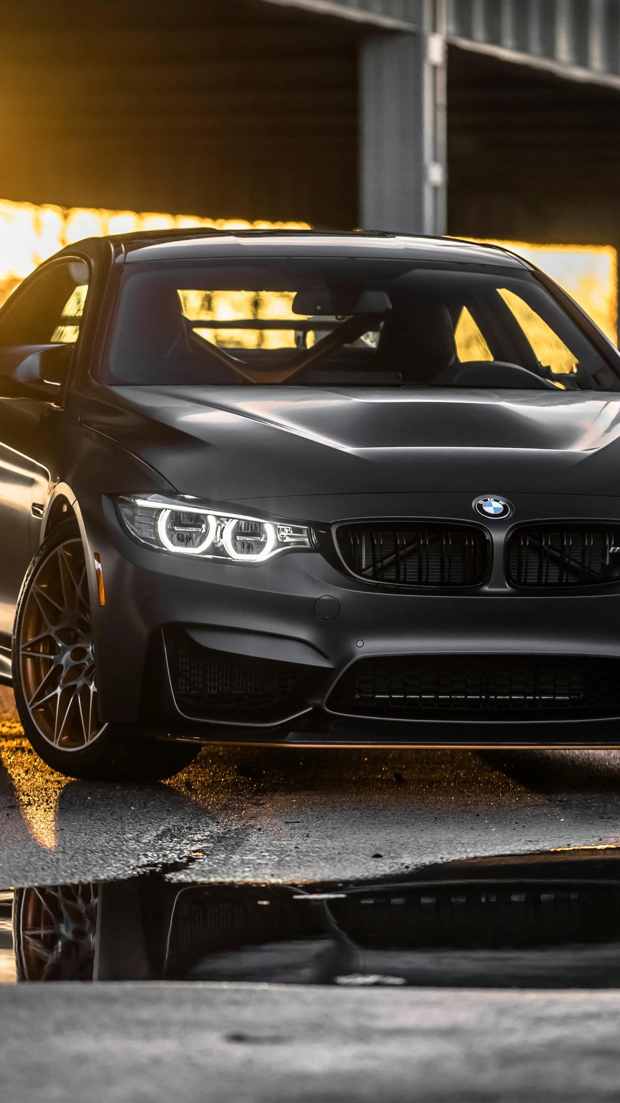 Luxury Bmw with Sunset Reflections on the Hood Wallpaper