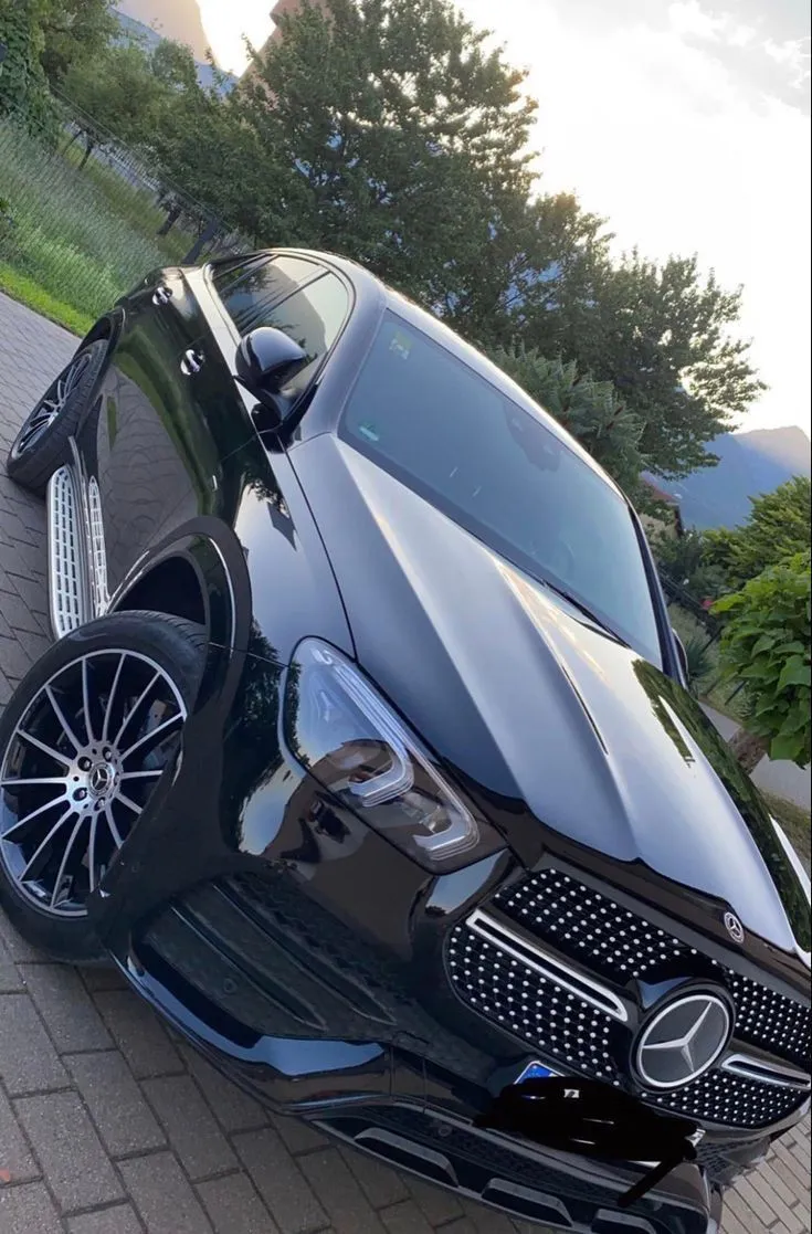 Luxury Mercedes Benz Parked Outdoors on a Brick Driveway