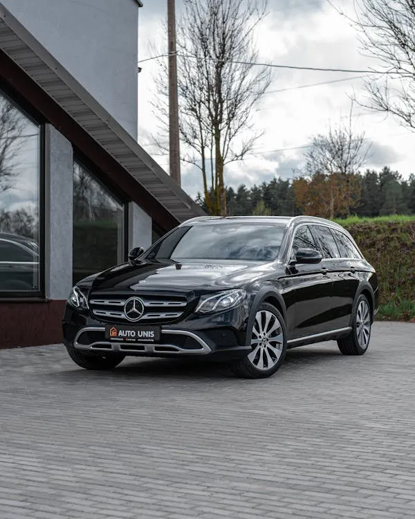 Luxury Mercedes Benz SUV Parked Outside Modern House