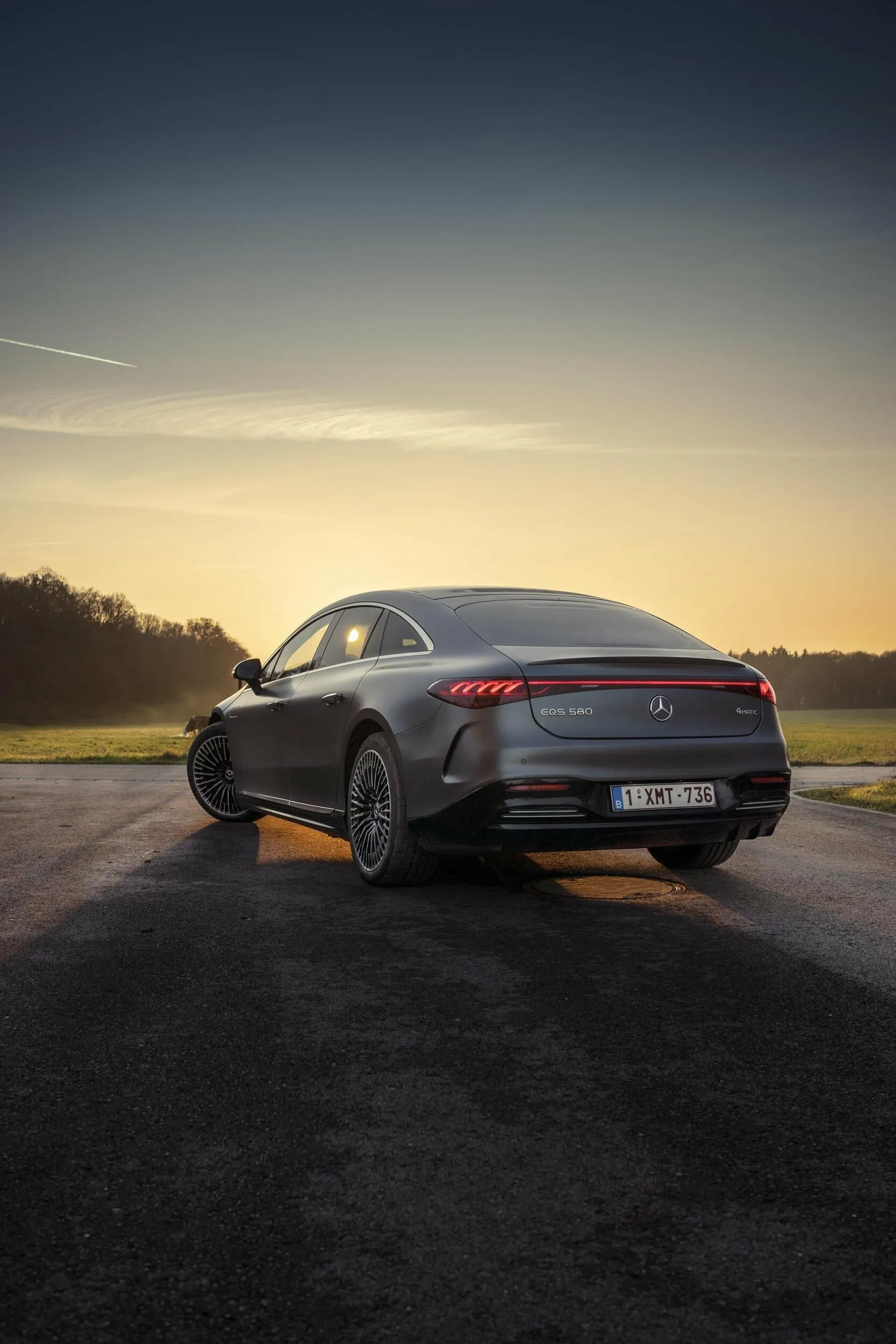Luxury Mercedes Sedan Driving at Sunset free Wallpaper