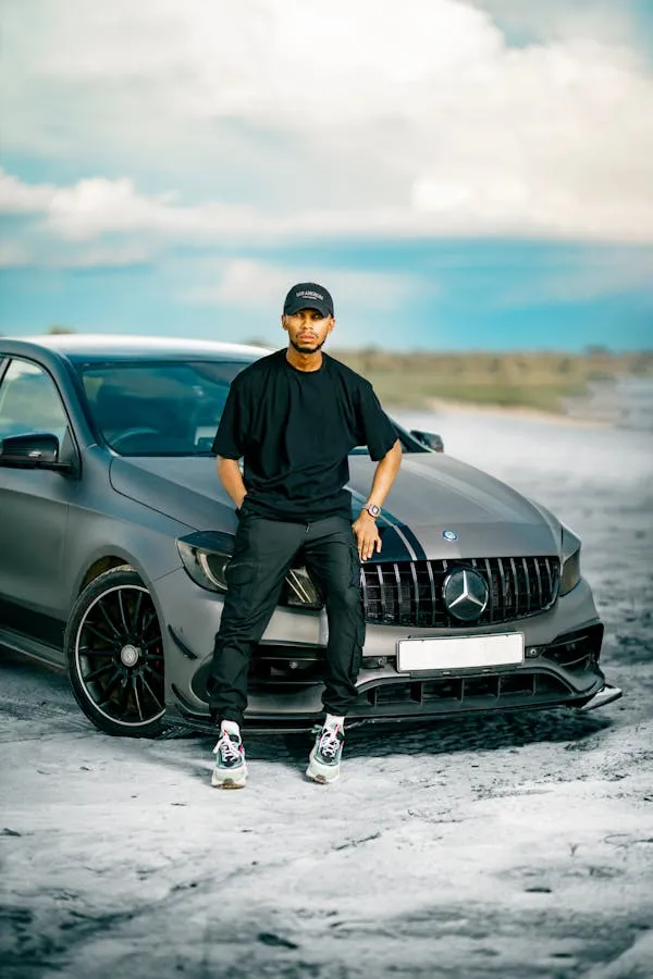 Man Standing Next to Mercedes Benz Car in Outdoor Scene