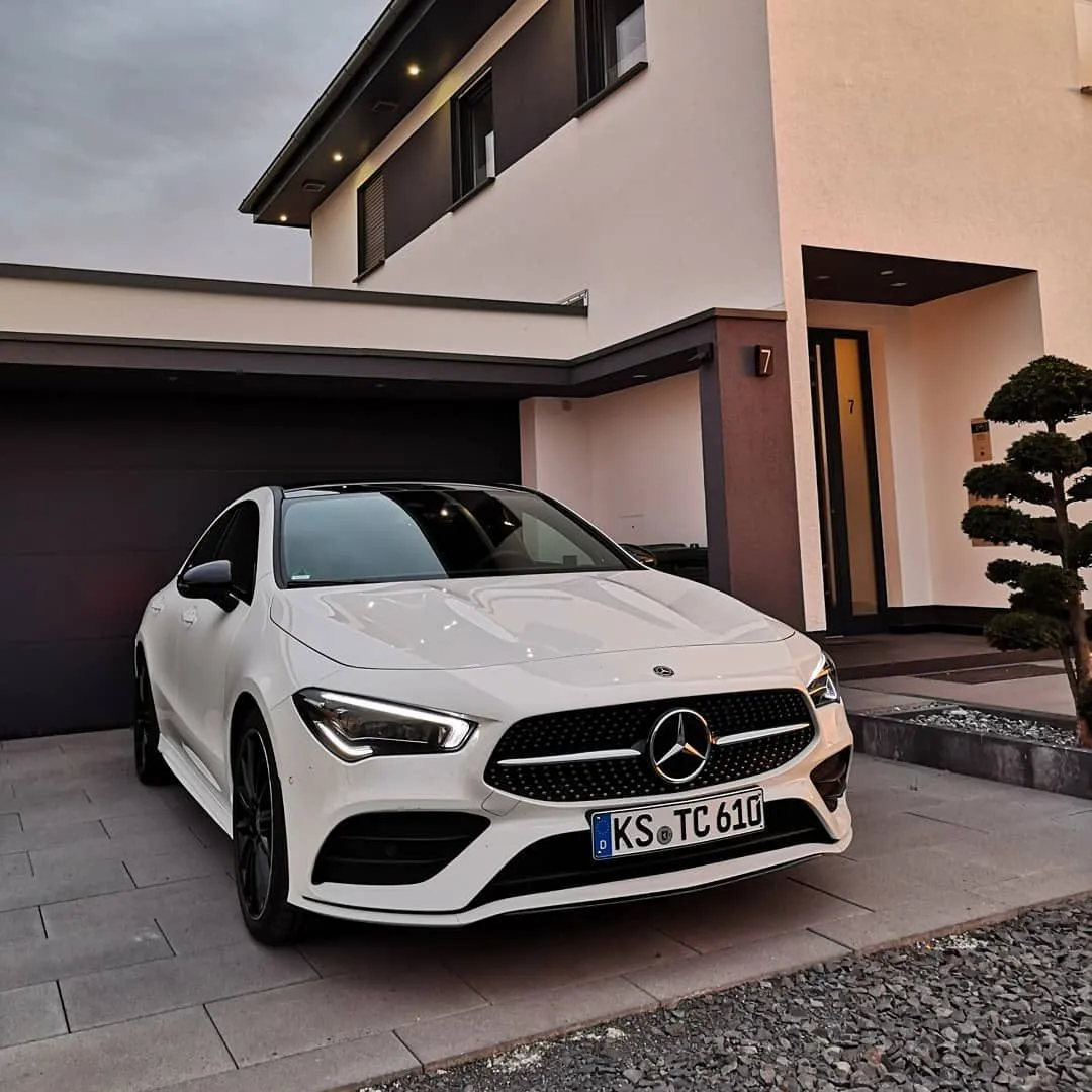 Marvelous White Mercedes Parked in Front of Modern Home