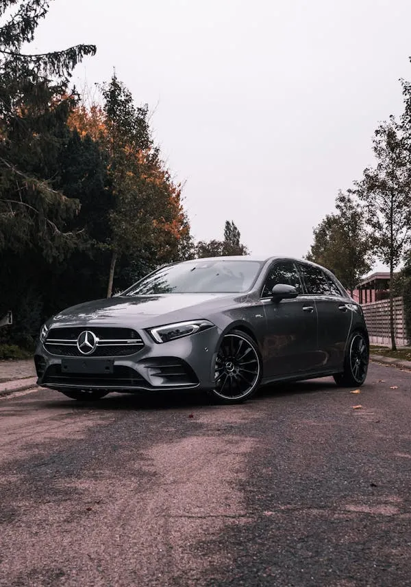 Matte Black Benz Coupe on Empty Street at Dusk Wallpaper