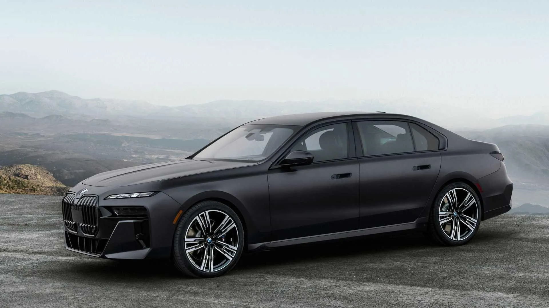 Matte Black Bmw Sedan Parked in Remote Desert Landscape