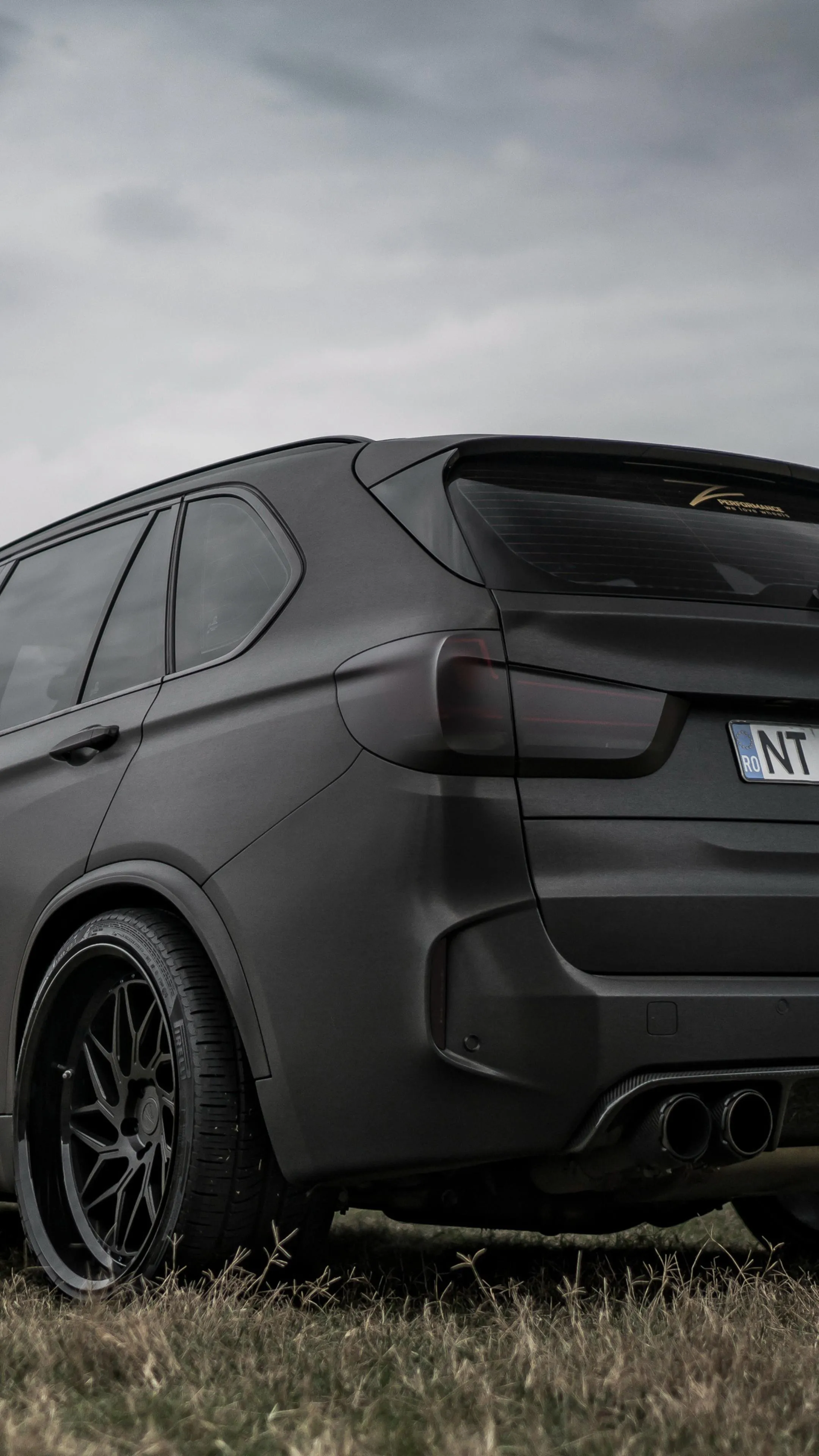 Matte Black Bmw Suv with Sporty Rear Design Free Wallpaper
