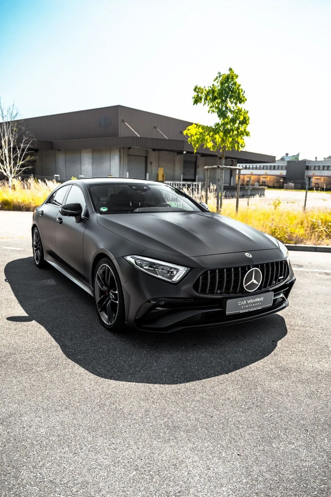 Matte Black Mercedes Coupe in Empty Urban Setting Wallpaper