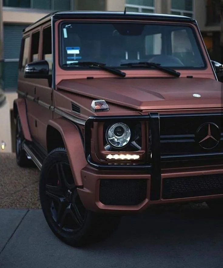 Matte Red Mercedes Benz G Wagon in Urban Area Wallpaper