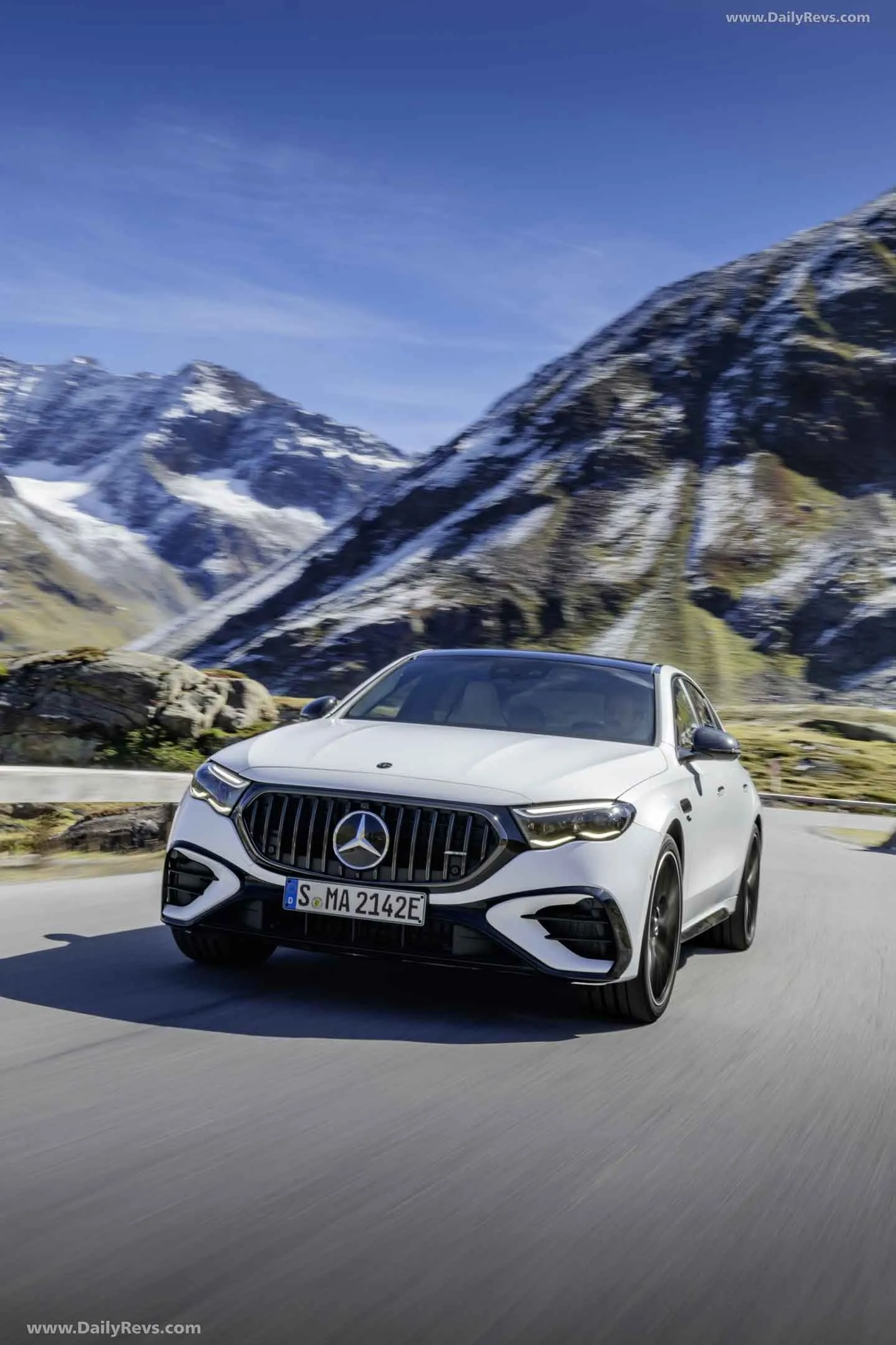 Mercedes AMG Driving Through Scenic Mountain View Wallpaper