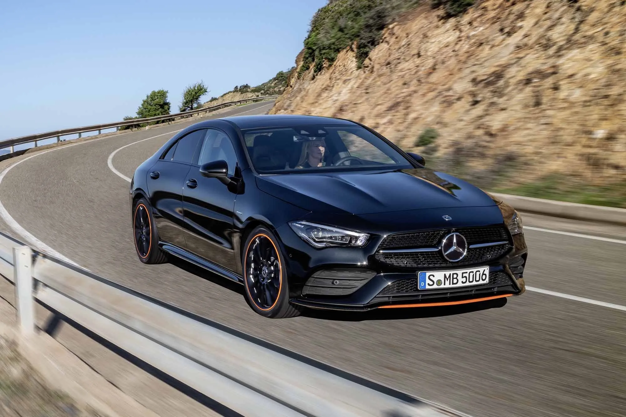 Mercedes AMG in Motion on Coastal Highway Road Wallpaper