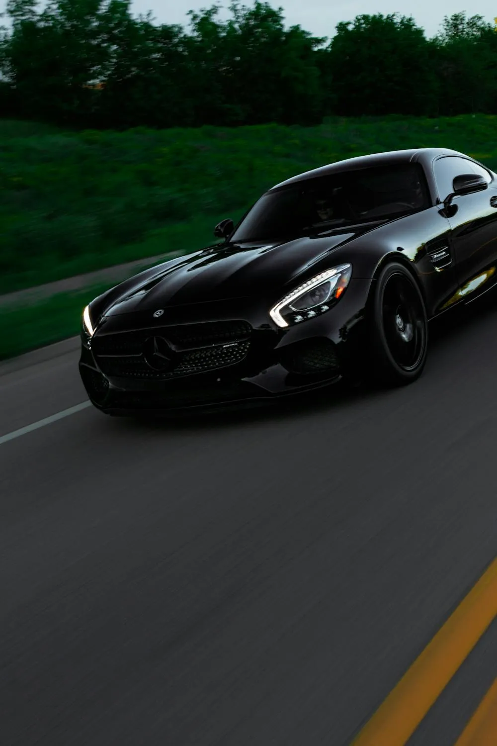 Mercedes AMG Speeding on Highway at Dusk Wallpaper