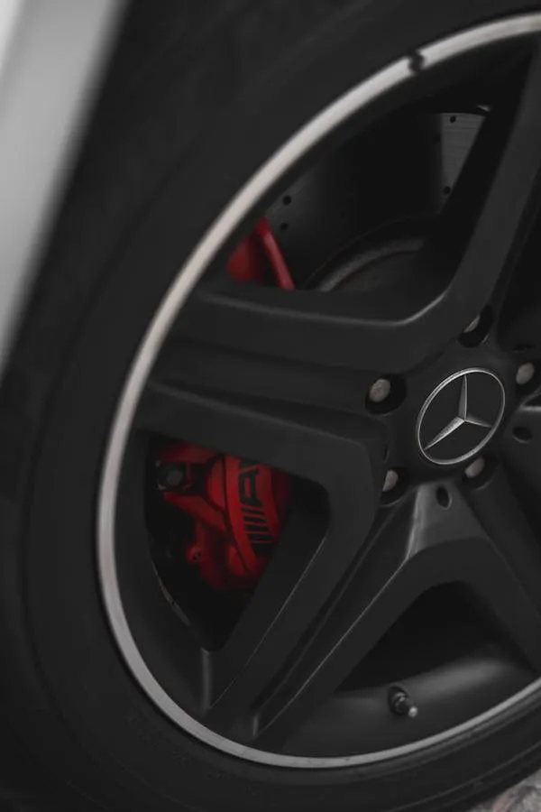 Mercedes AMG Wheel with Red Brake Caliper Close Up Wallpaper