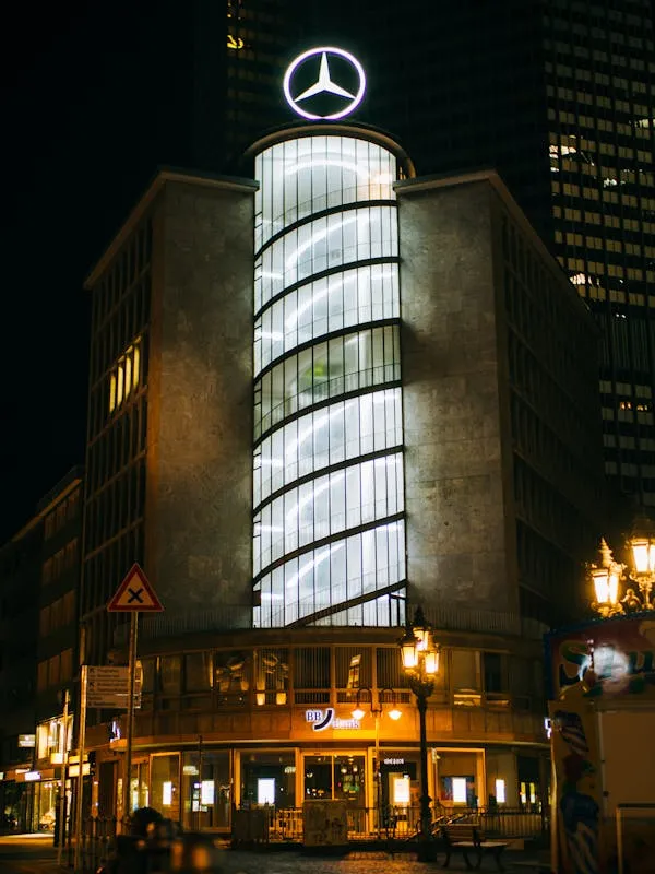 Mercedes Benz Building Illuminated at Nighttime View