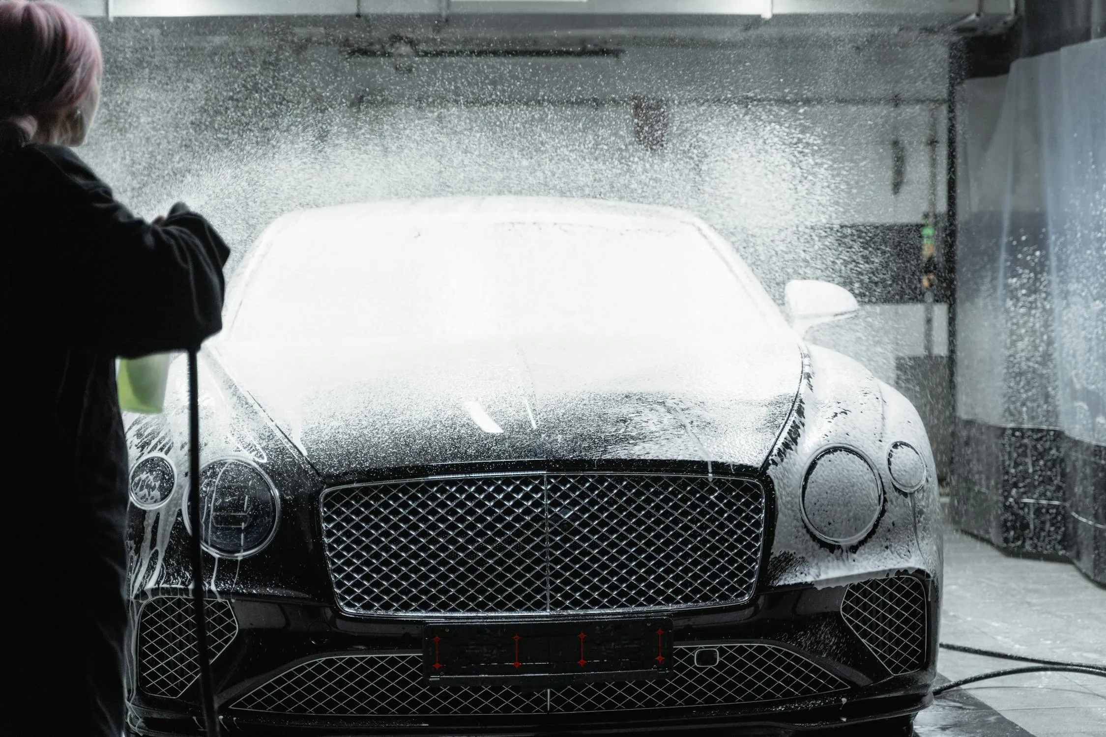 Mercedes Benz car getting washed in an automated car wash