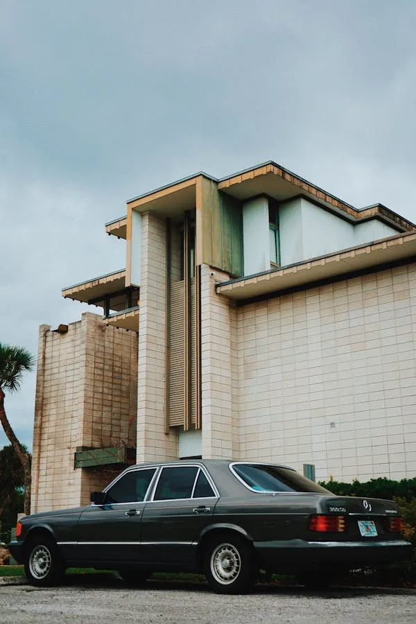 Mercedes Benz Classic Car Parked by Modern Architecture