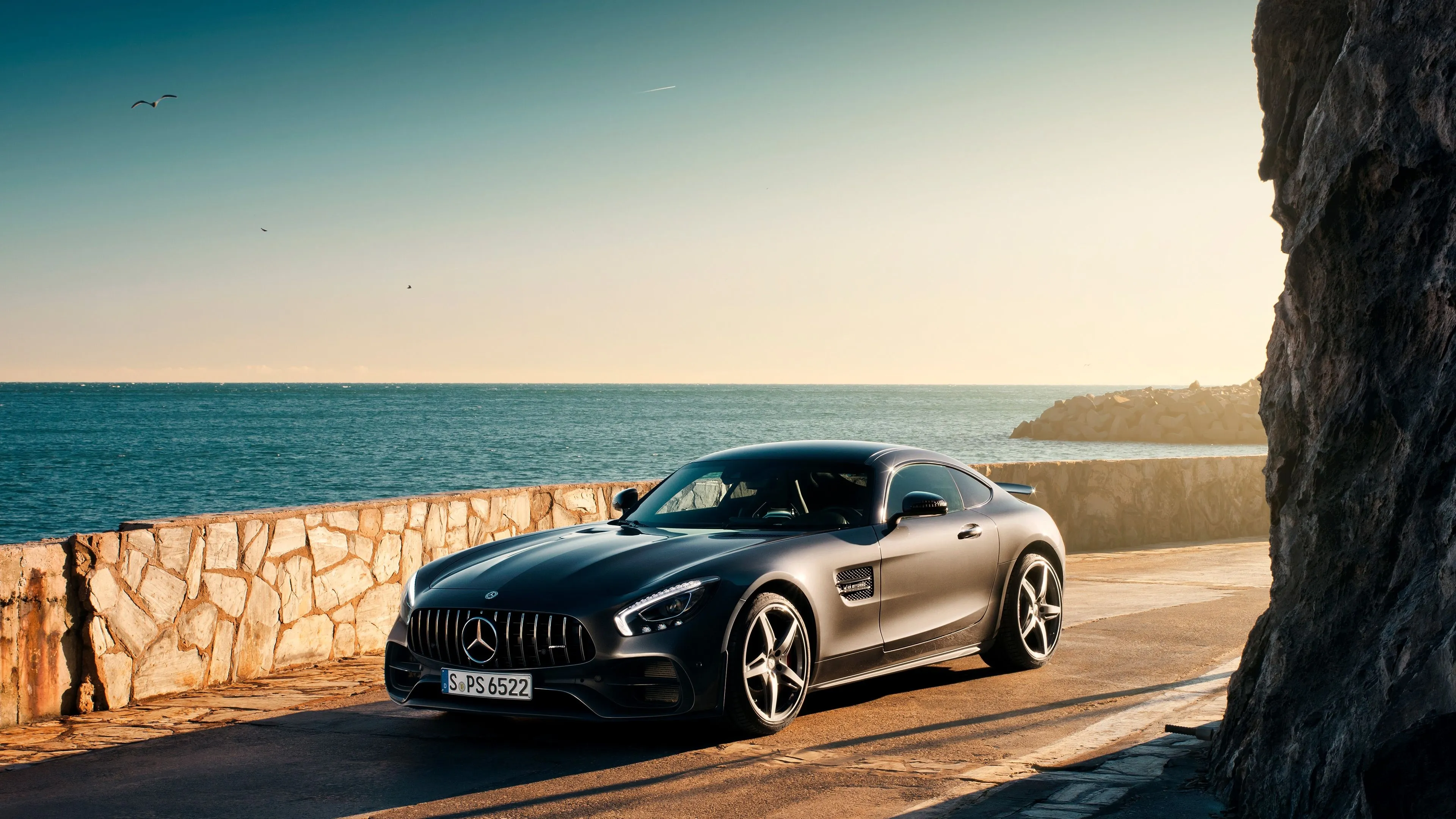 Mercedes Benz Convertible Parked by Ocean at Sunset