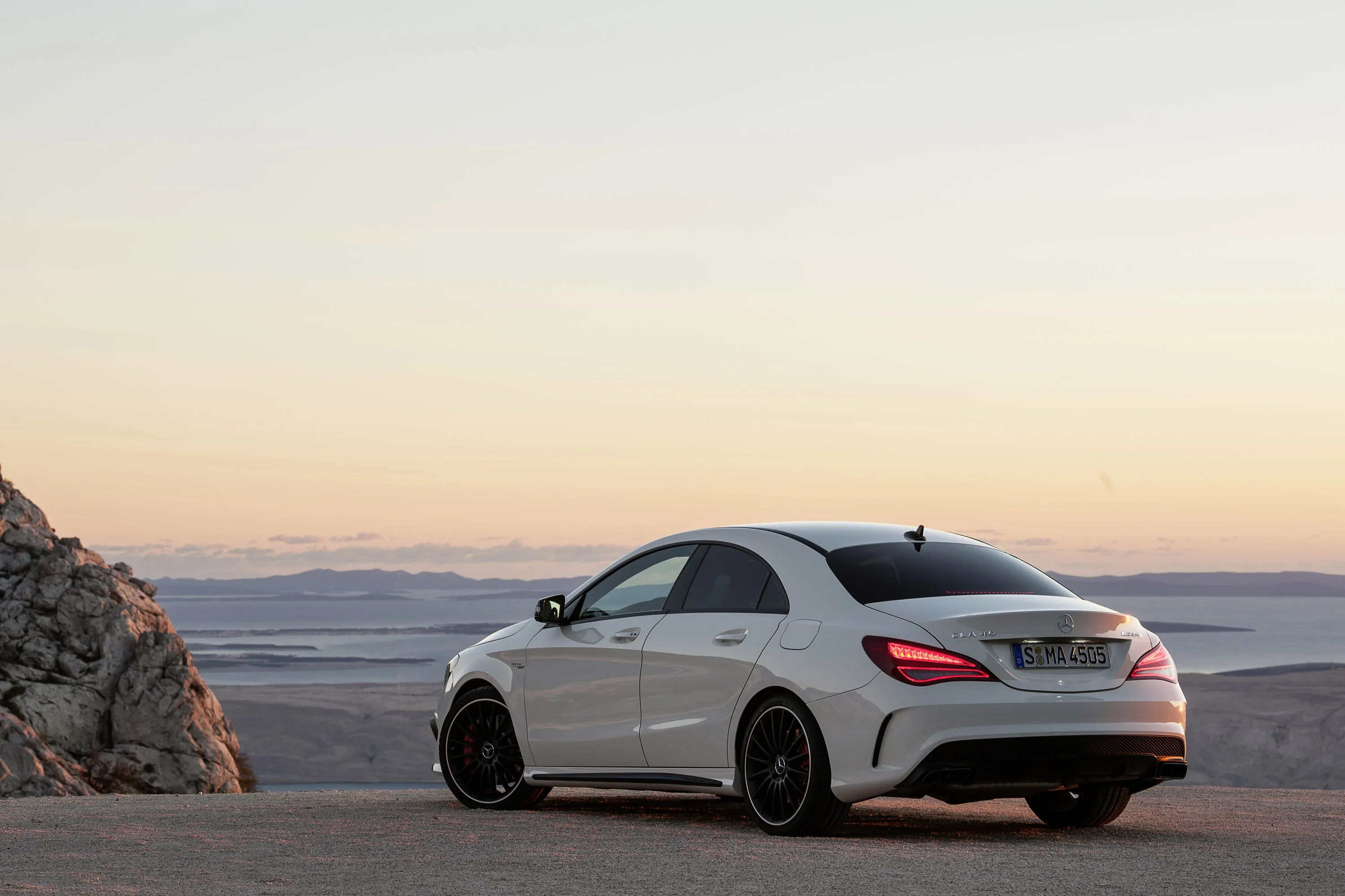 Mercedes Benz Coupe Parked with Sunset Ocean View image