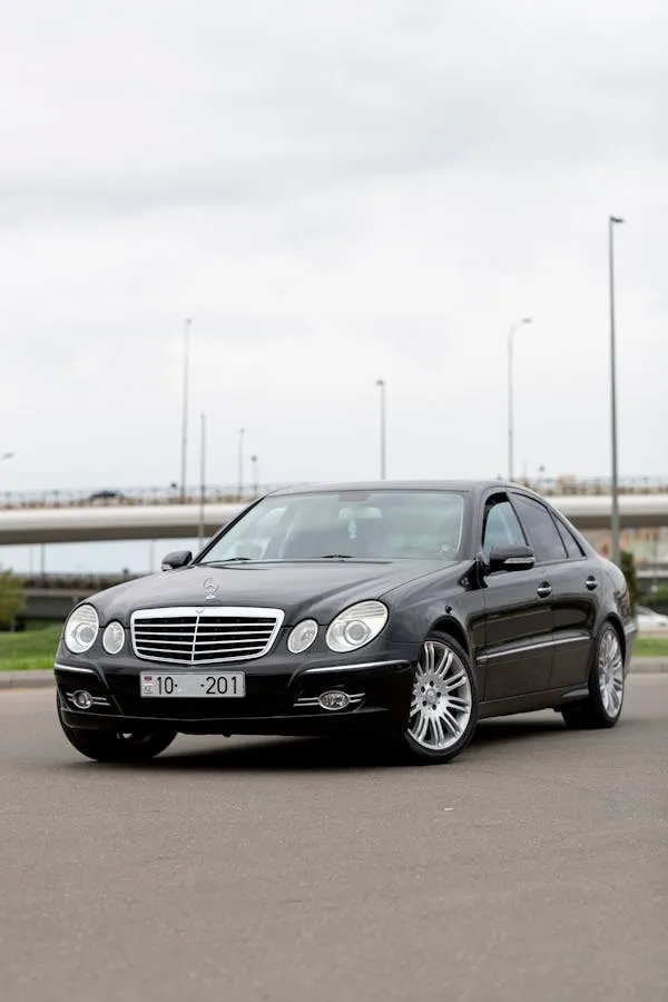 Mercedes Benz E Class Sedan Parked on Open Road Wallpaper