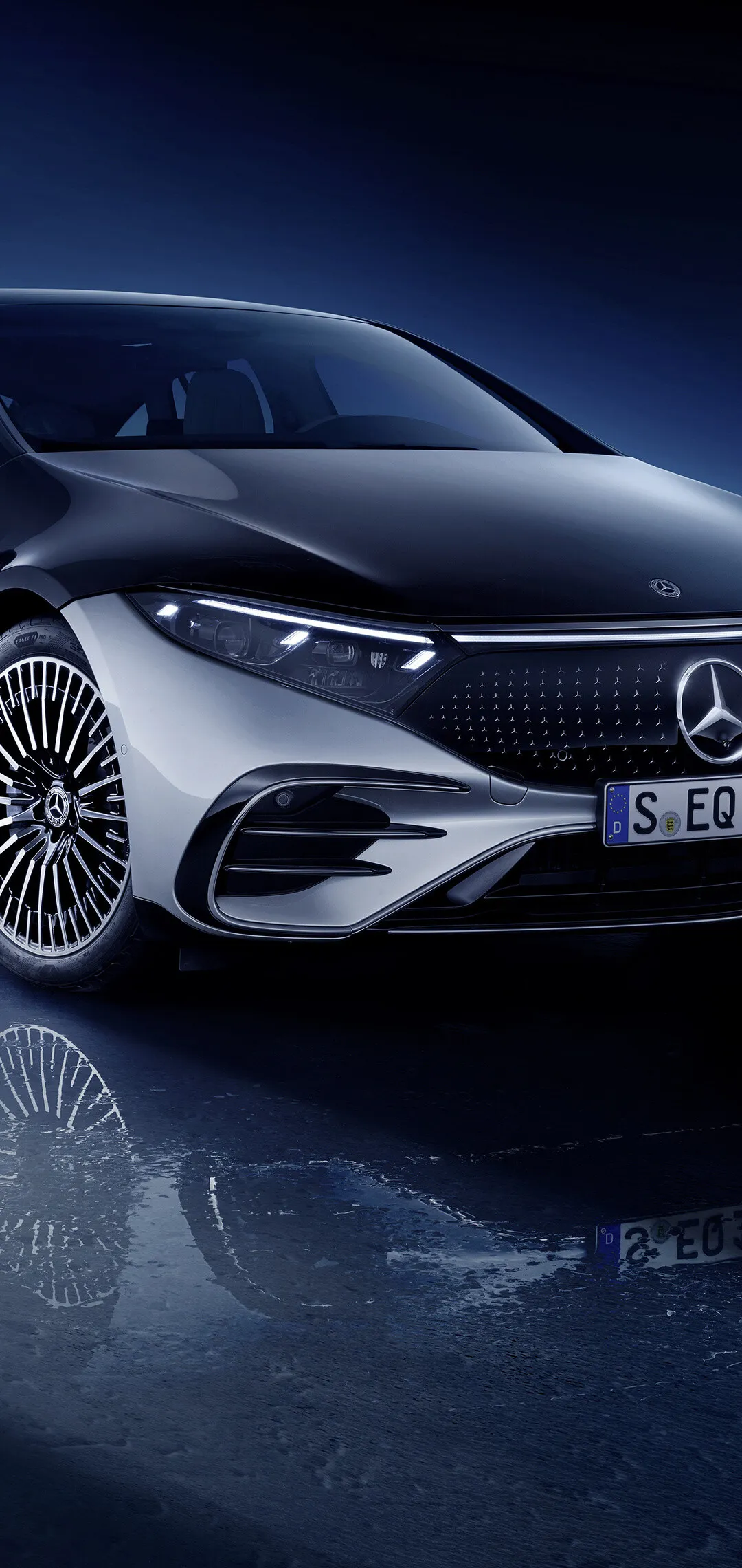 Mercedes Benz Electric Sedan at Night Under Blue Light