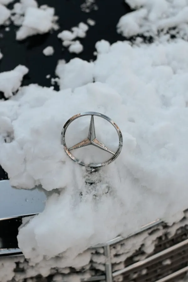 Mercedes Benz Emblem Covered in Deep Snow Wallpaper