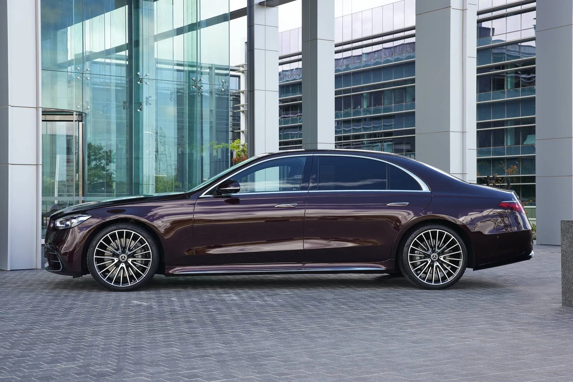 Mercedes Benz Executive Sedan Outside Modern Glass Office