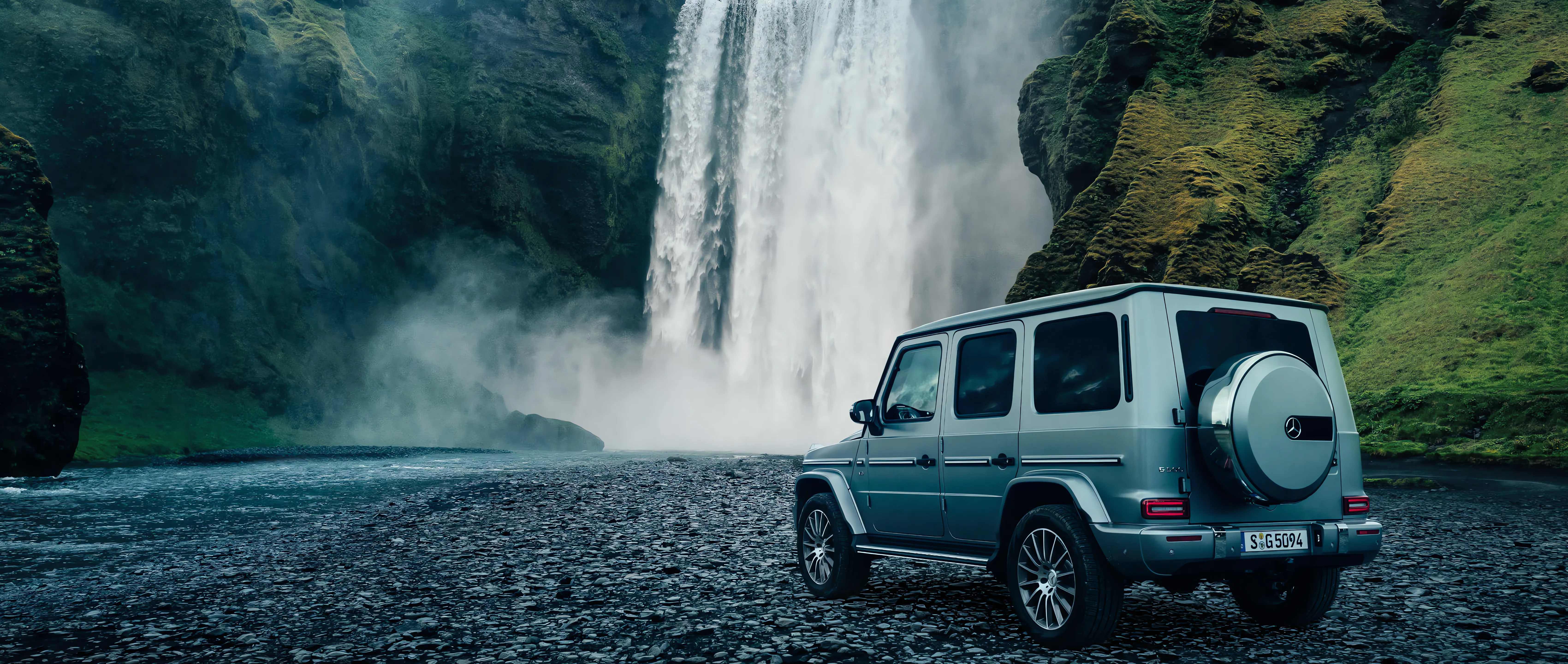 Mercedes Benz G Wagon by a Scenic Waterfall Landscape