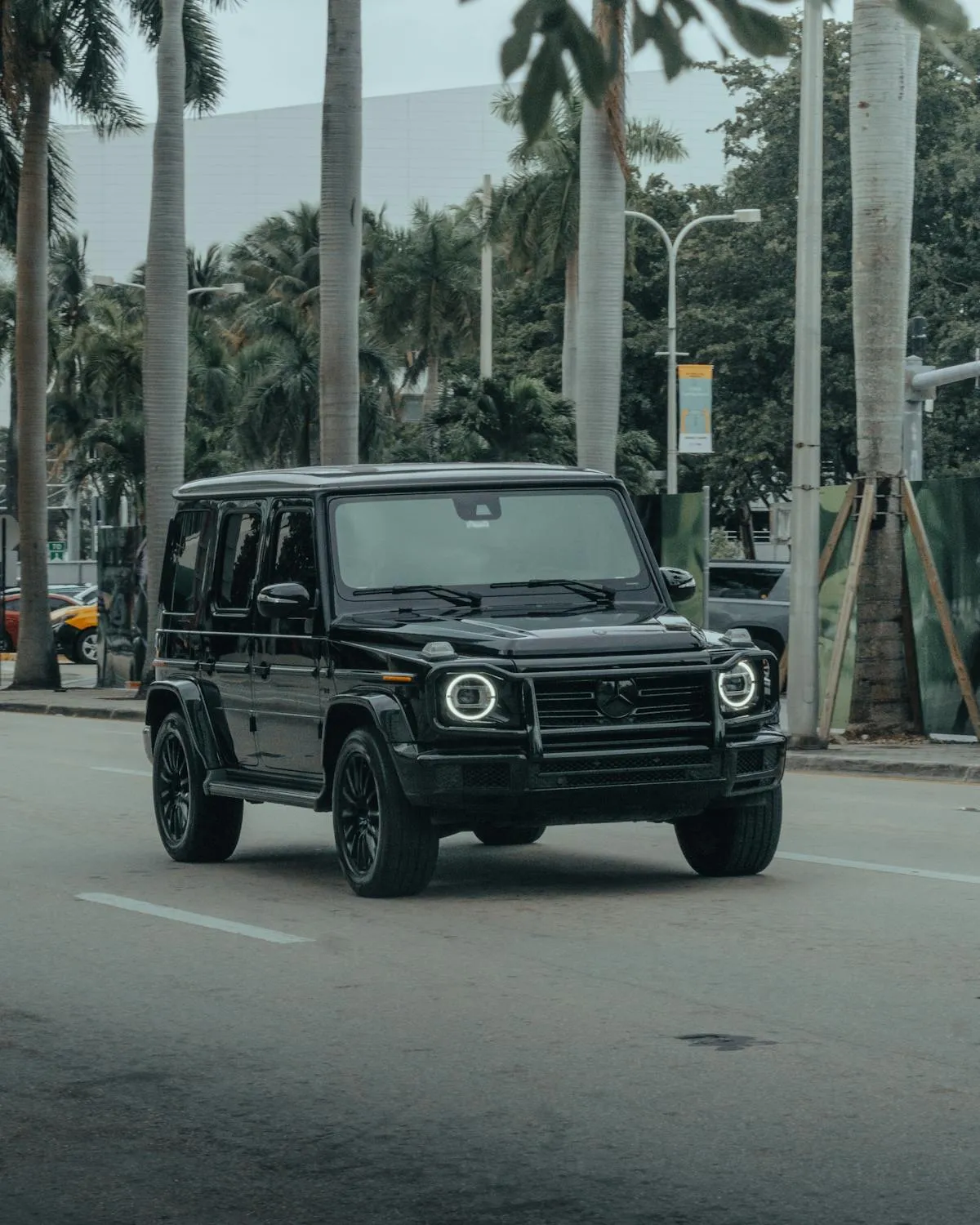Mercedes Benz G Wagon Parked on Street with Palm Trees