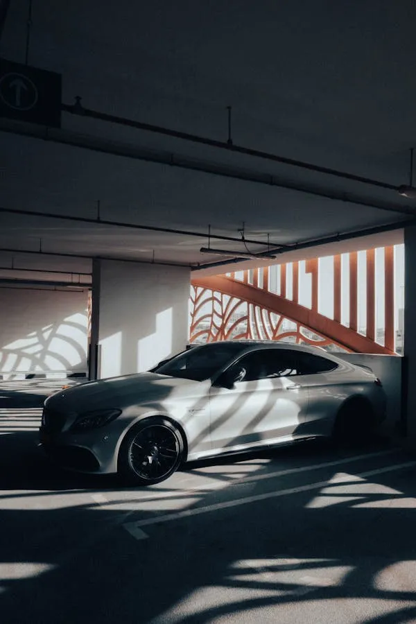 Mercedes Benz in Shadowed Parking Garage Setting Wallpaper