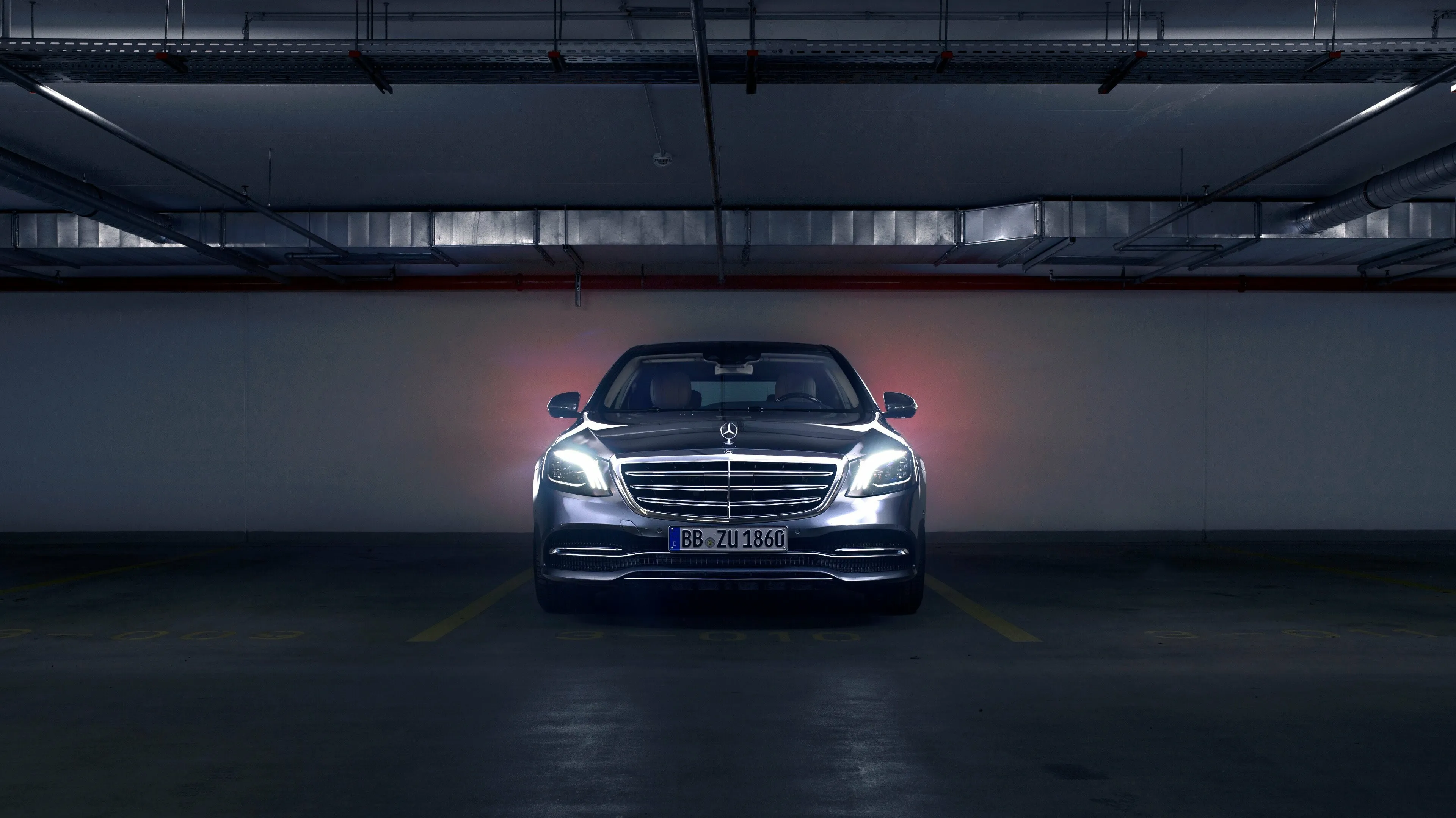 Mercedes Benz in Underground Garage with Headlights On
