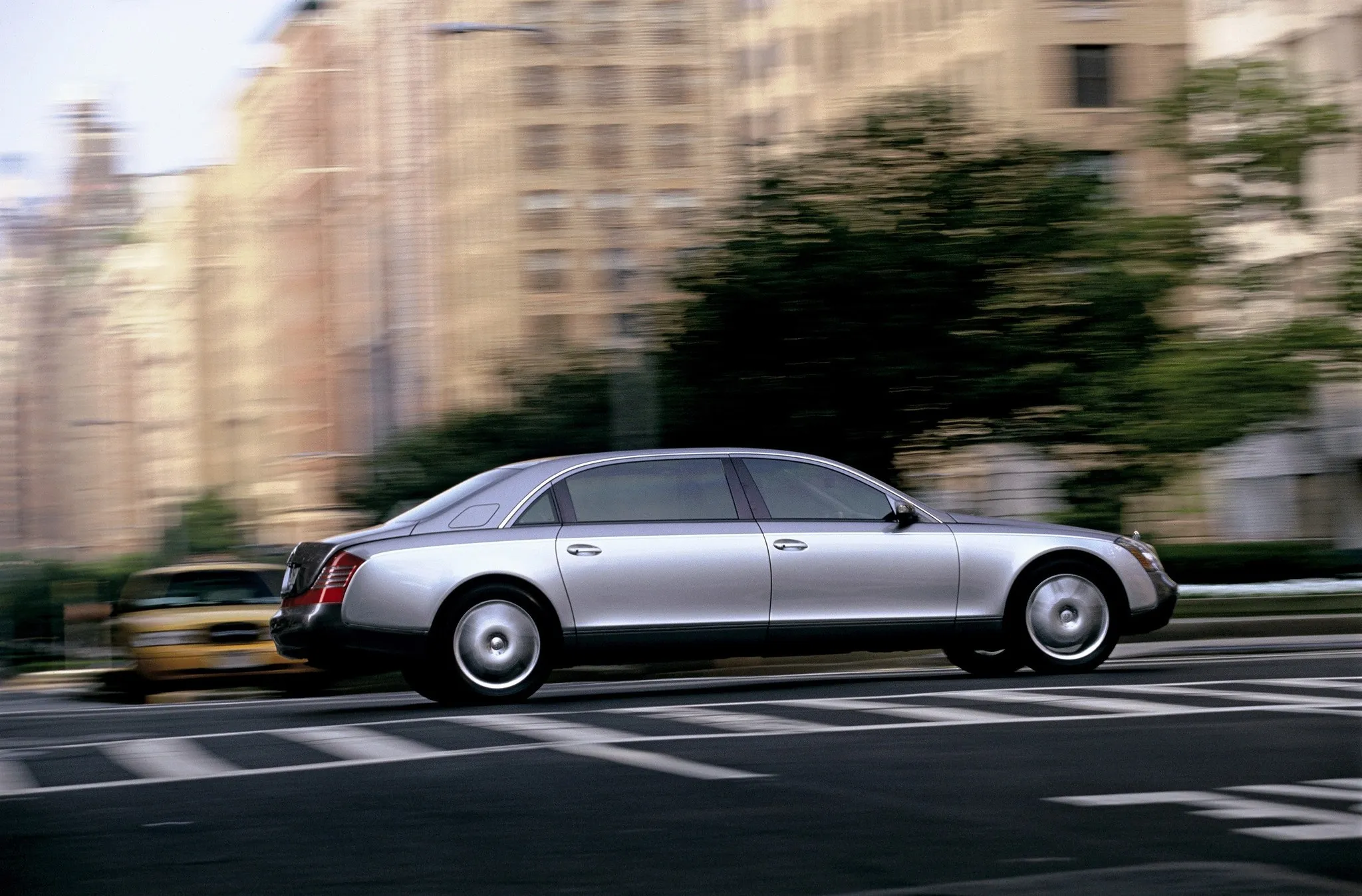 Mercedes Benz Limousine Driving Fast in City Traffic