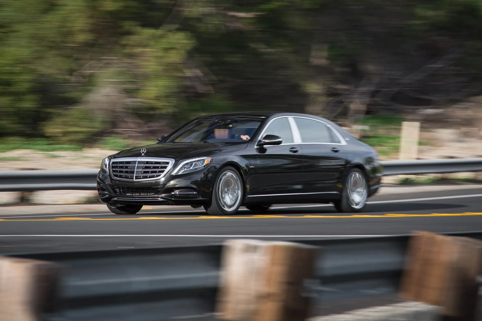 Mercedes Benz Luxury Sedan Driving on Highway Outdoors