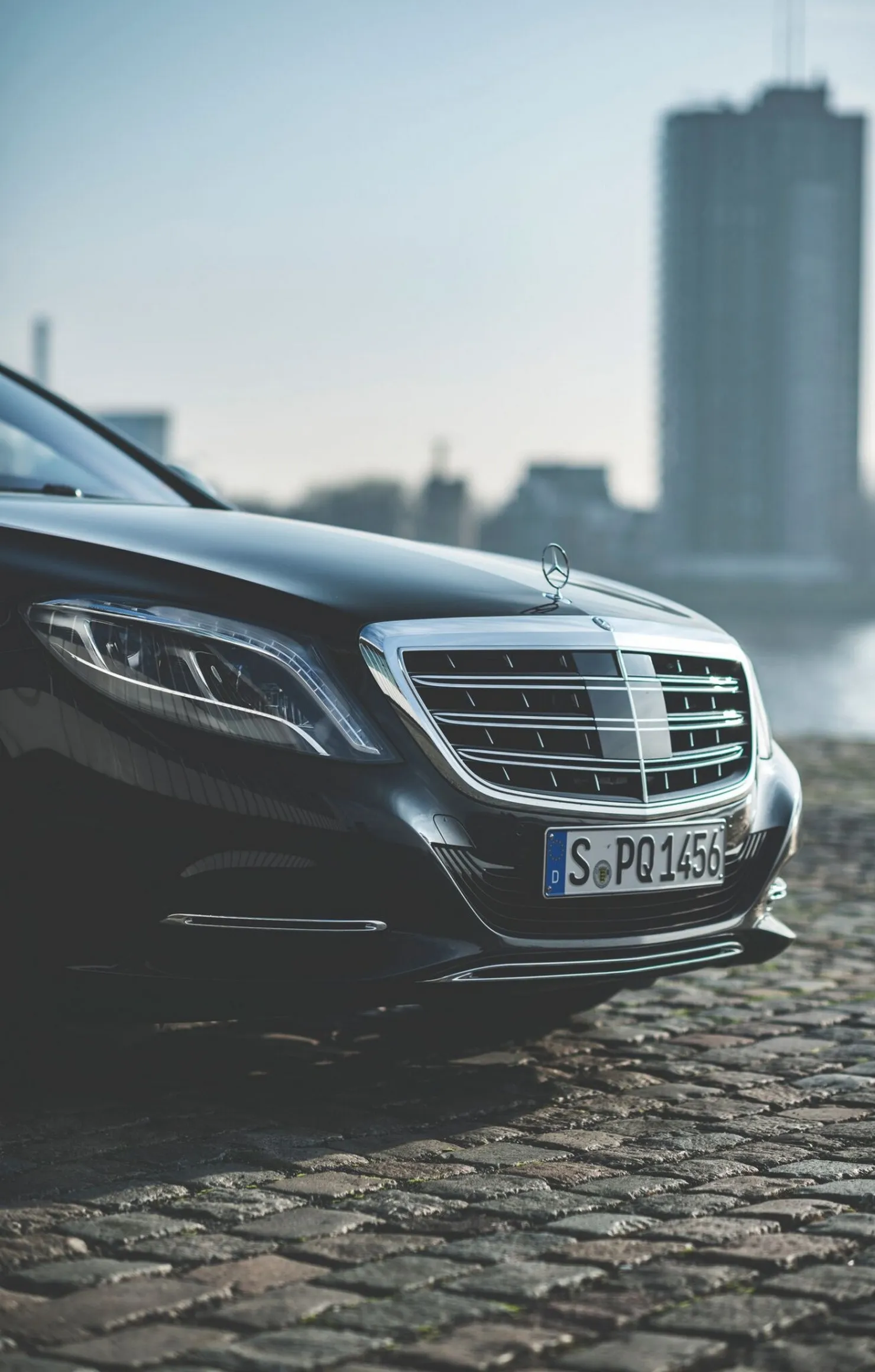 Mercedes Benz Luxury Sedan Parked on Cobblestone Road