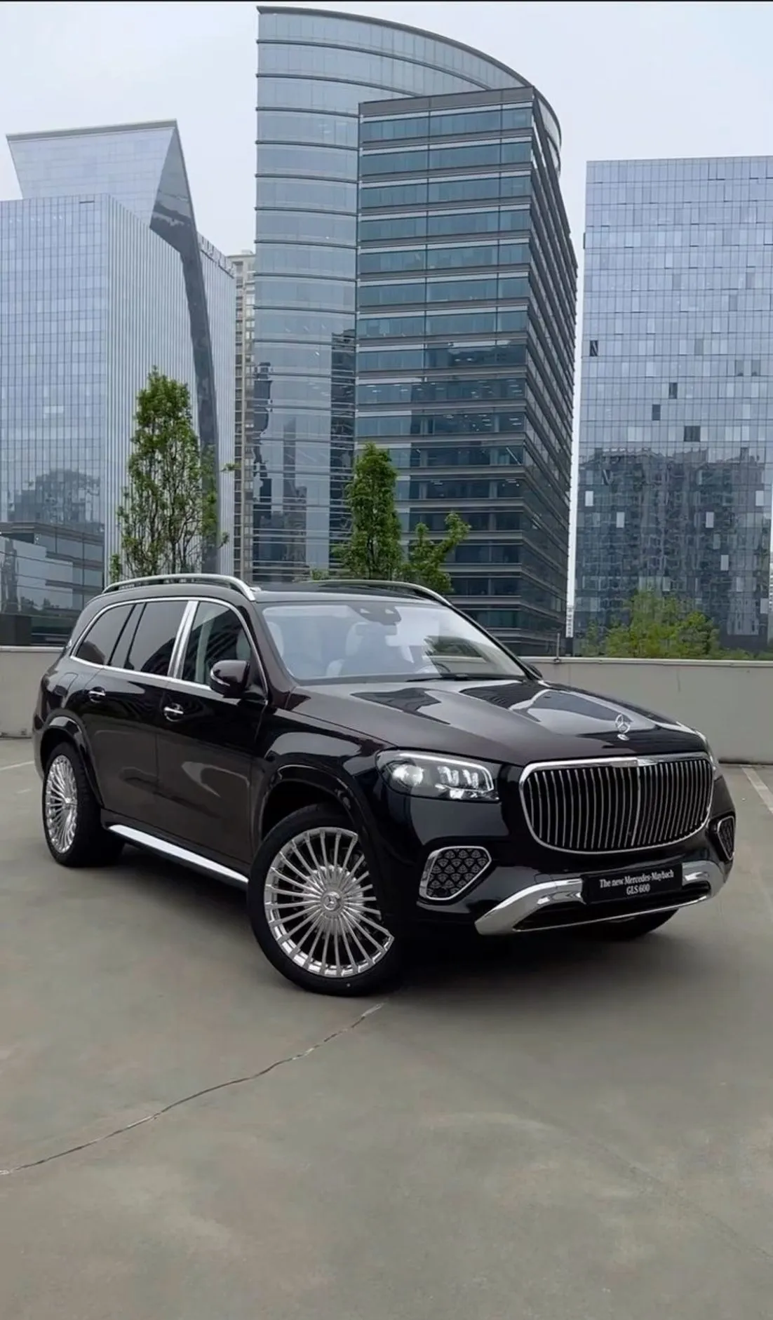 Mercedes Benz Maybach SUV Outside Modern Office Buildings