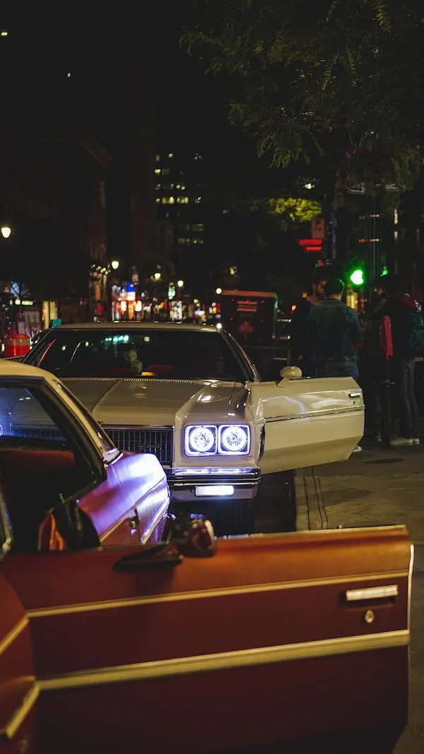 Mercedes Benz Night Scene with Headlights and City Life