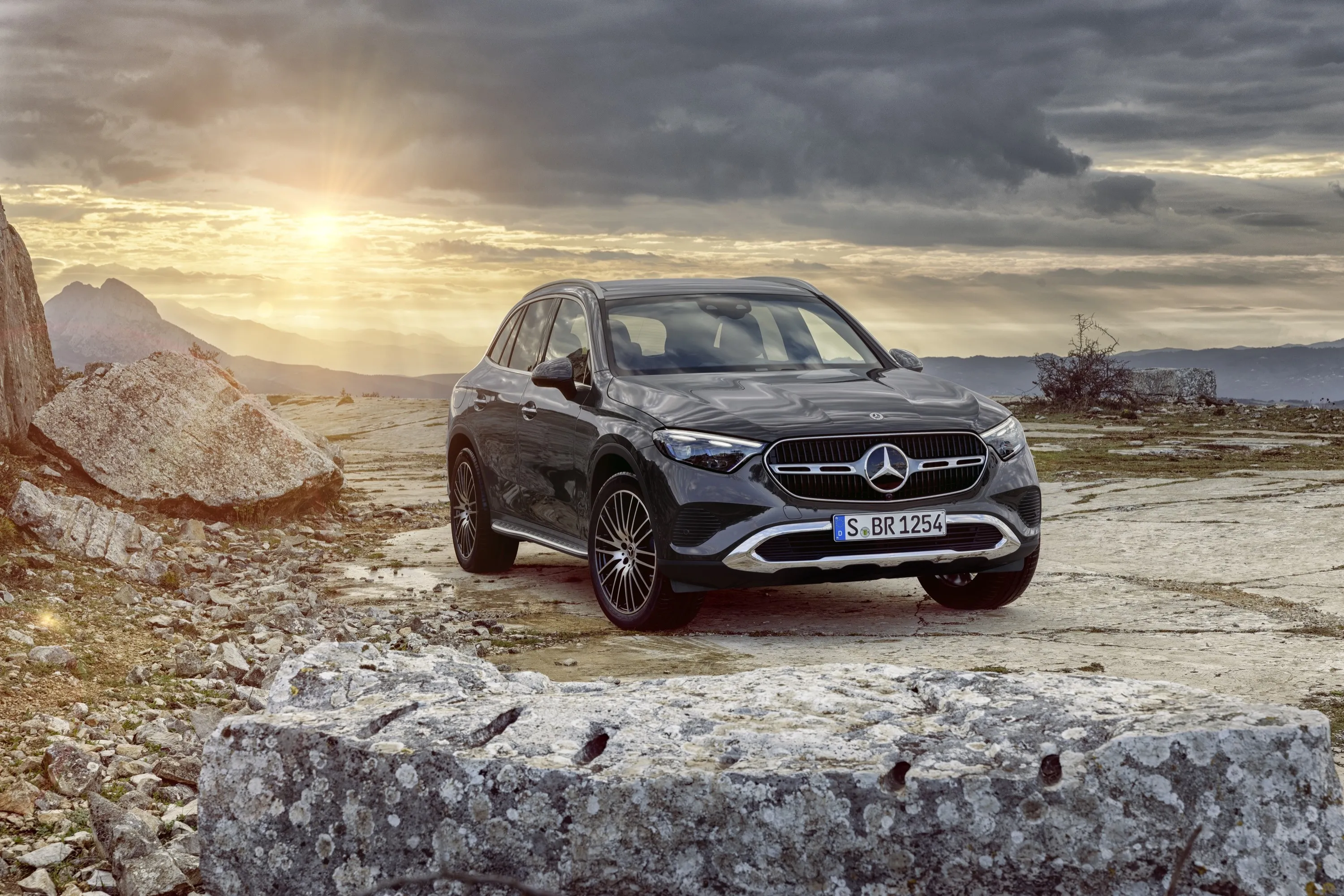 Mercedes Benz Offroad SUV Driving Over Rocky Hilltop