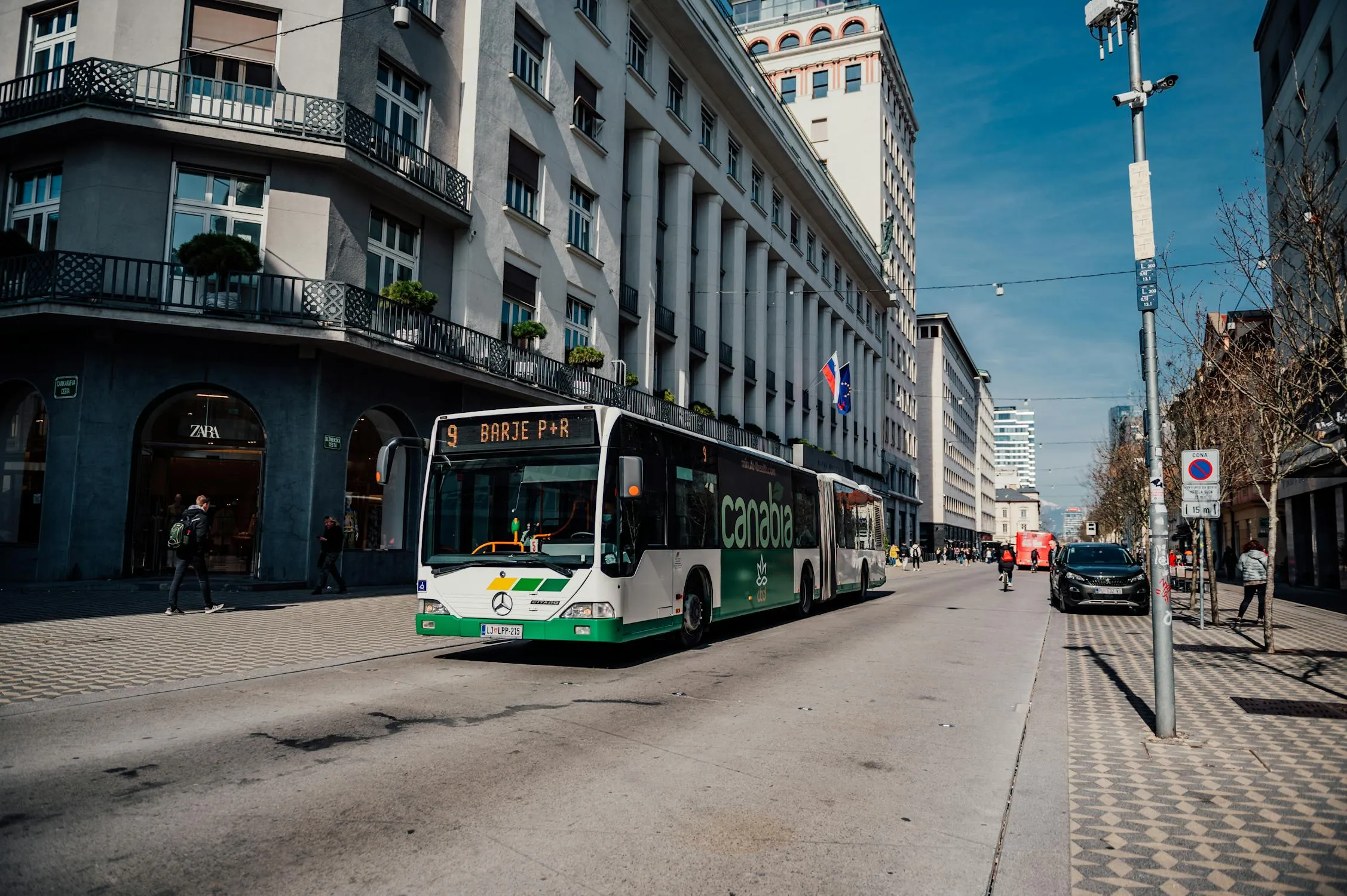 Mercedes Benz Parked on a City Street with Buildings