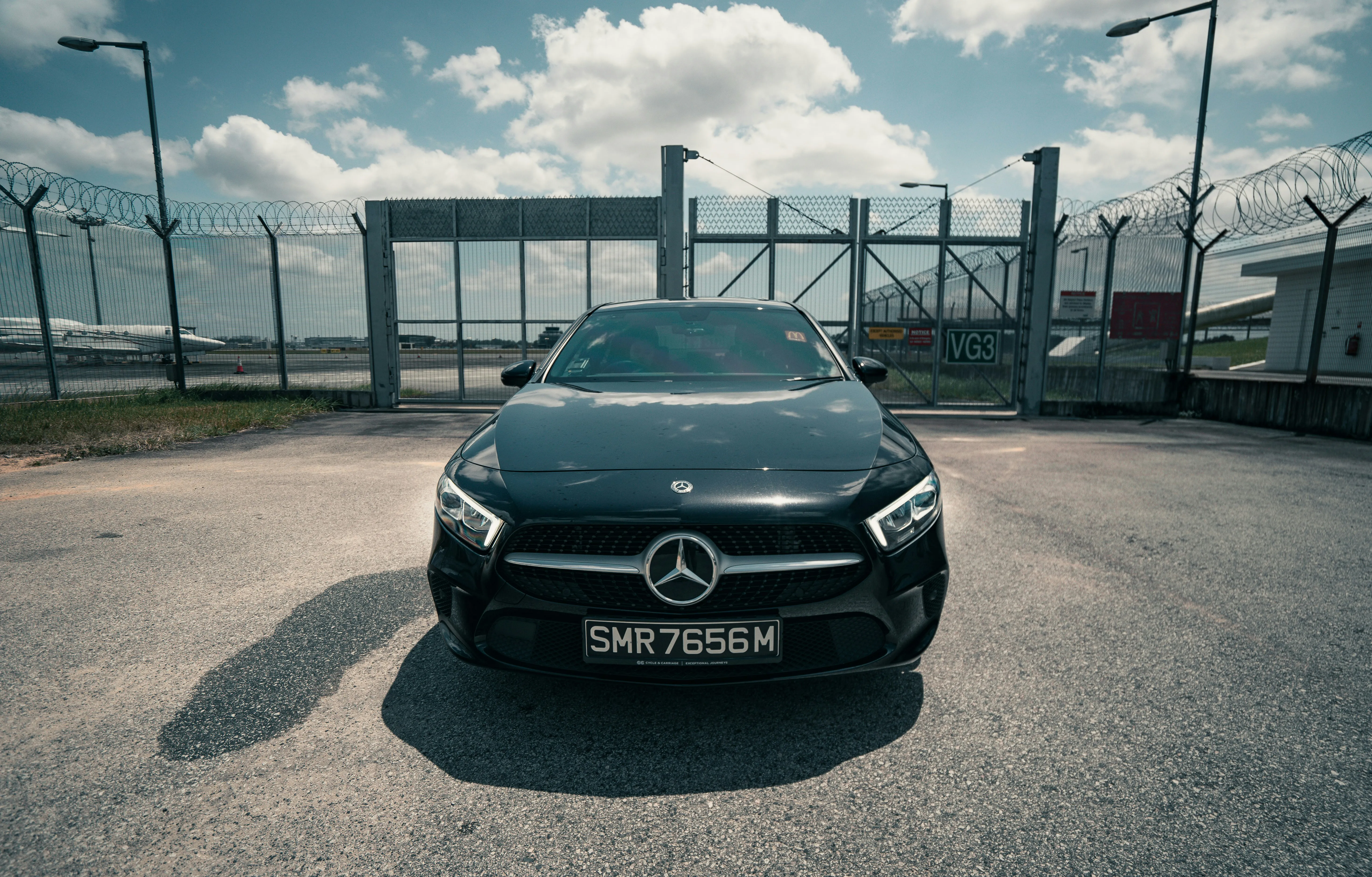 Mercedes Benz Parked Outside Under Cloudy Sky image