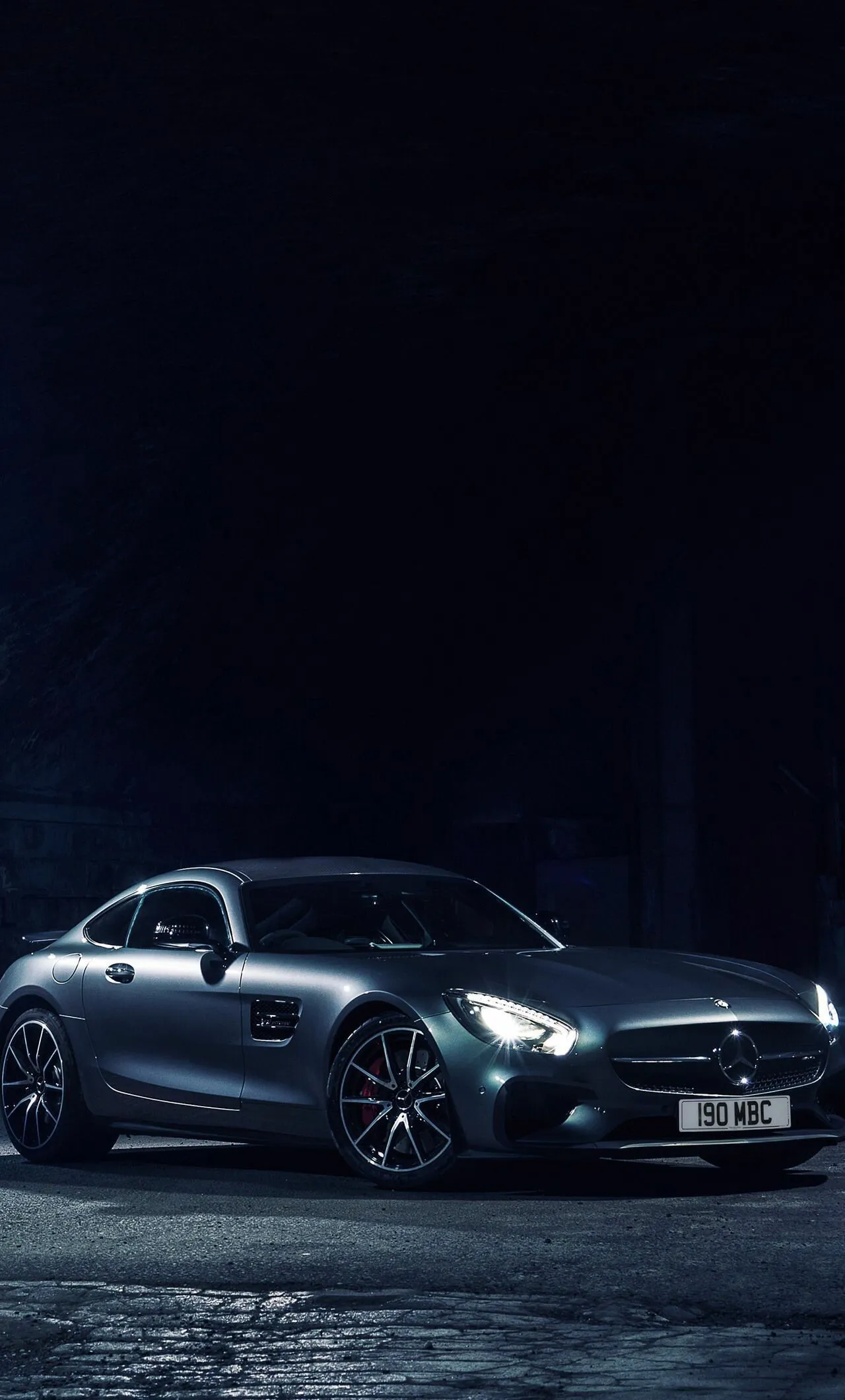 Mercedes Benz Sedan Driving at Night with Headlights On