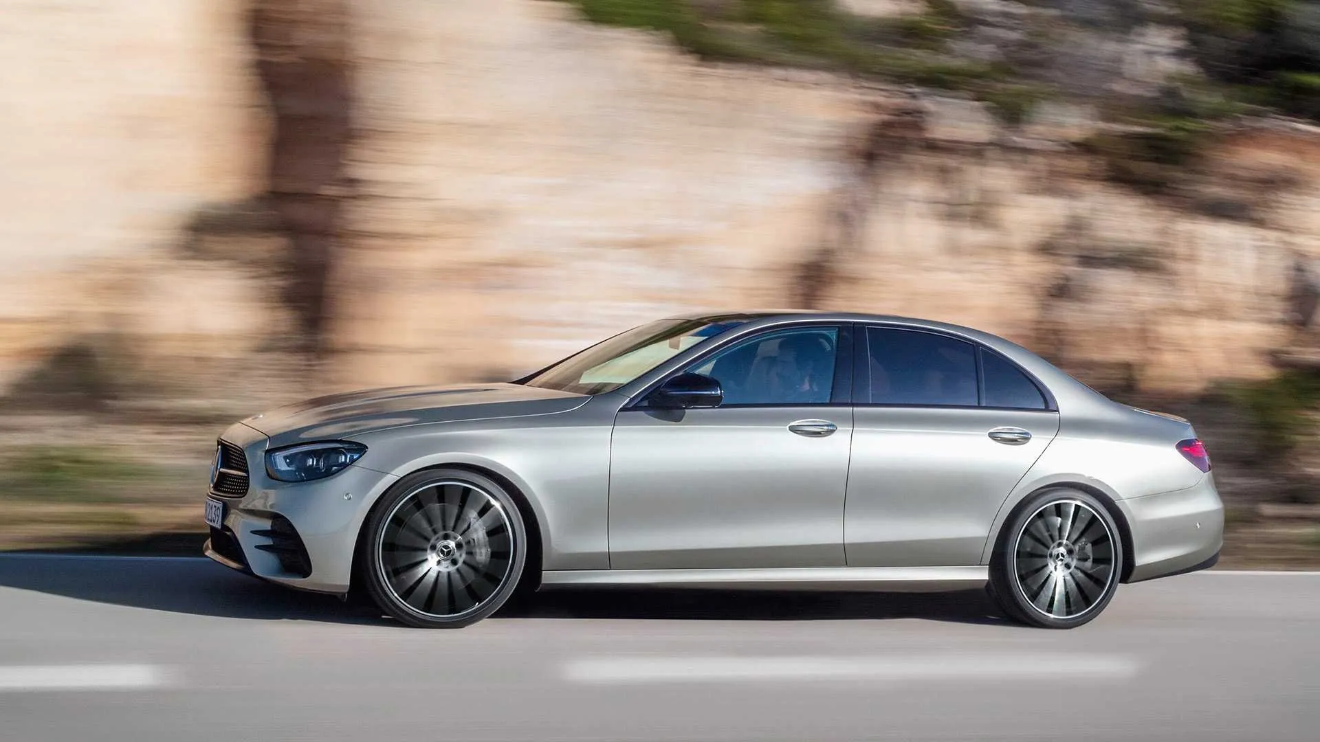 Mercedes Benz Sedan Driving Fast on Curved Mountain Road