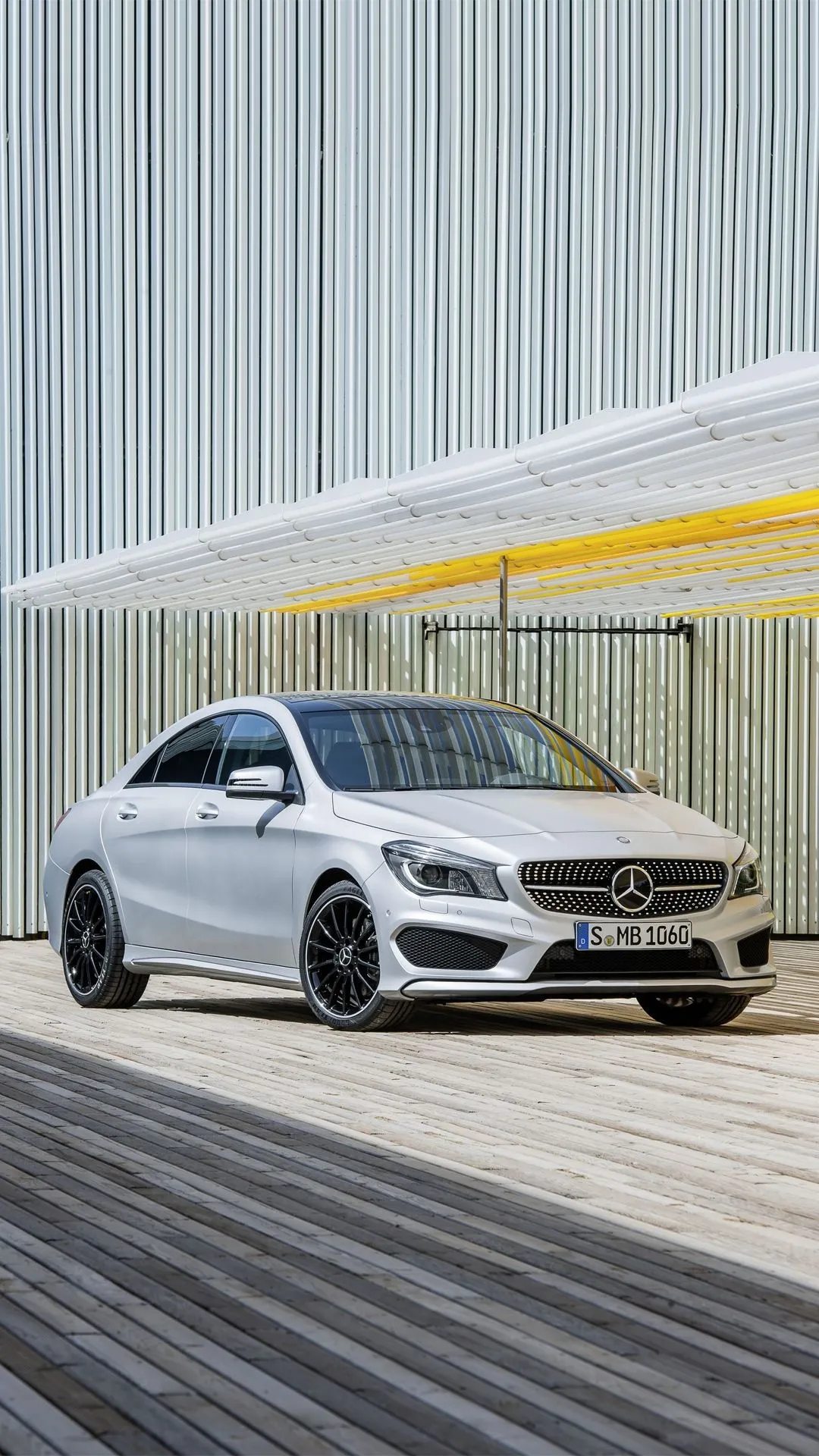 Mercedes Benz Sedan Near a Modern Architectural Building