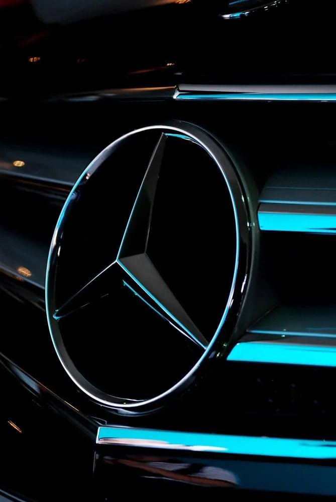 Mercedes Benz Star Logo Close Up with Neon Lights Wallpaper