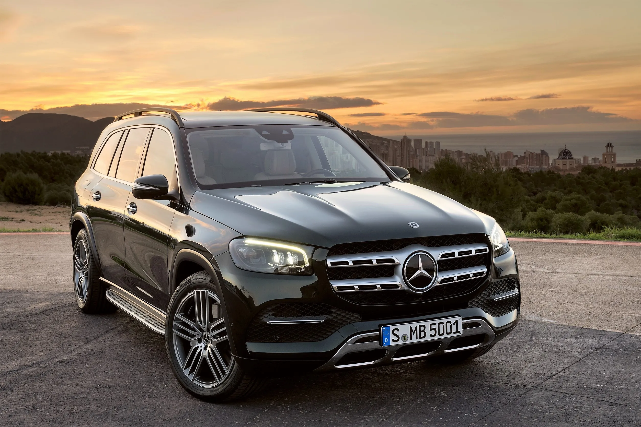 Mercedes Benz SUV at Sunset in Scenic Desert Road Wallpaper